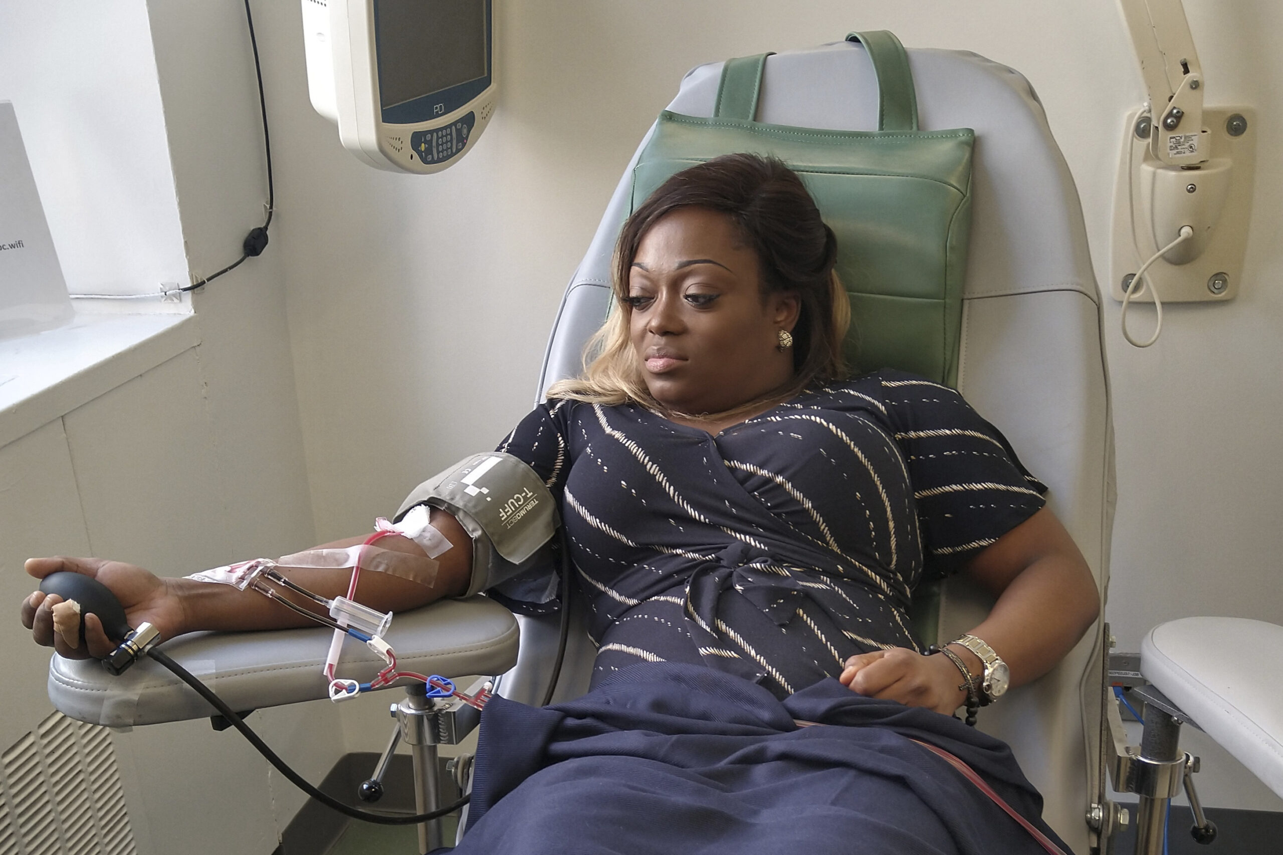 Tiffany Pinckney donates blood for a COVID-19 study at a hospital