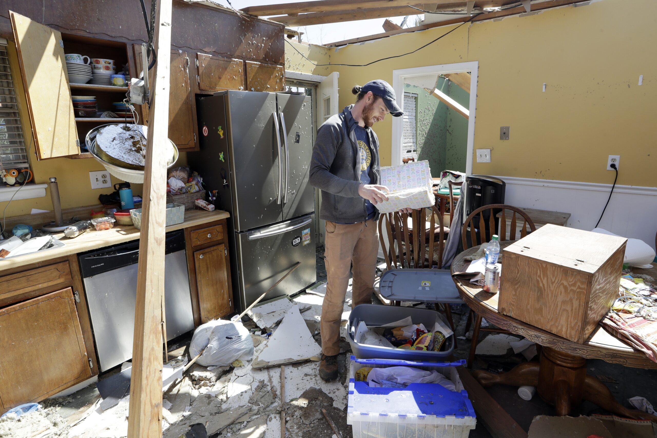A Chattanooga, Tenn. resident looks to salvage items from a home damaged by tornadoes.