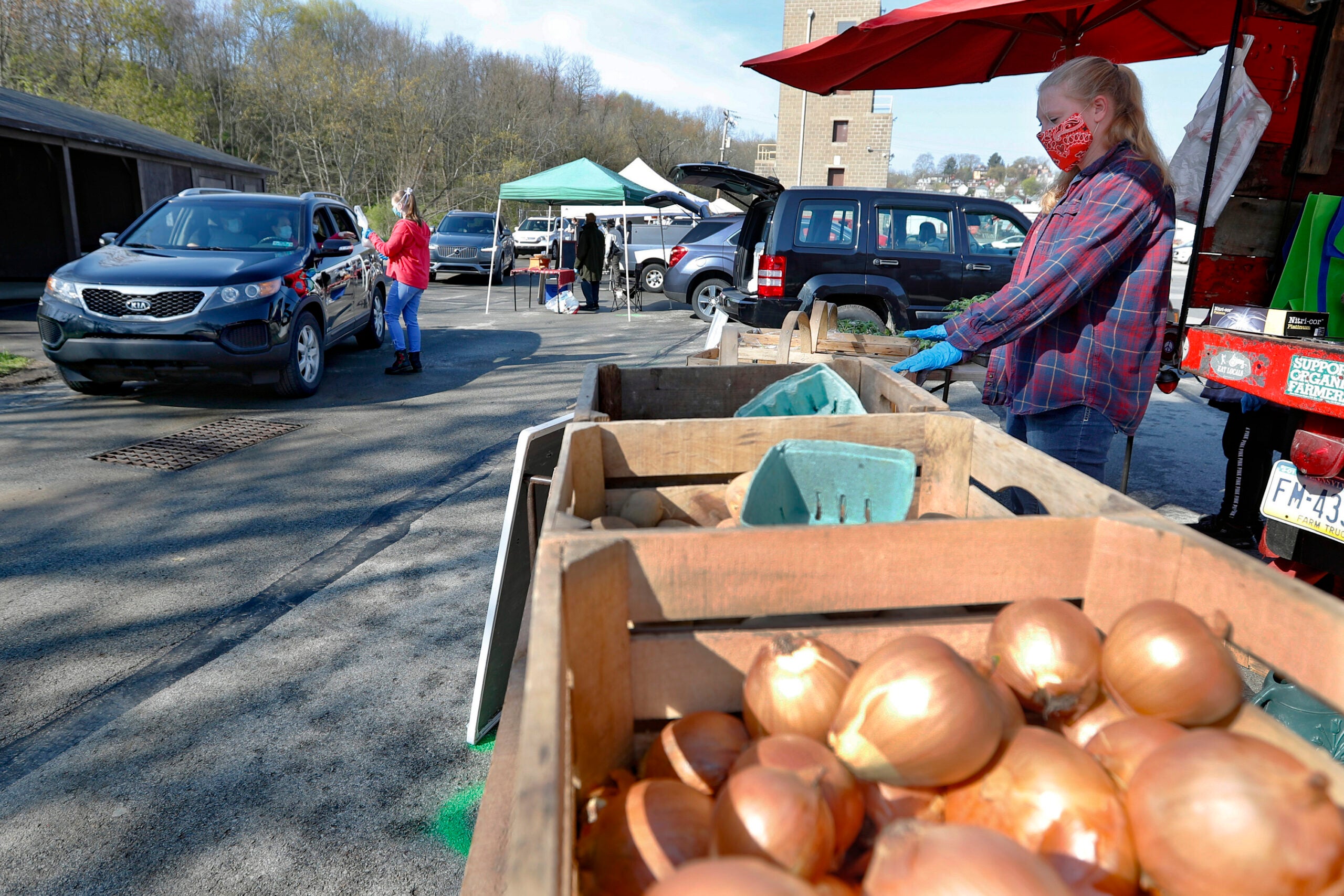 Farmers market seller in a mask