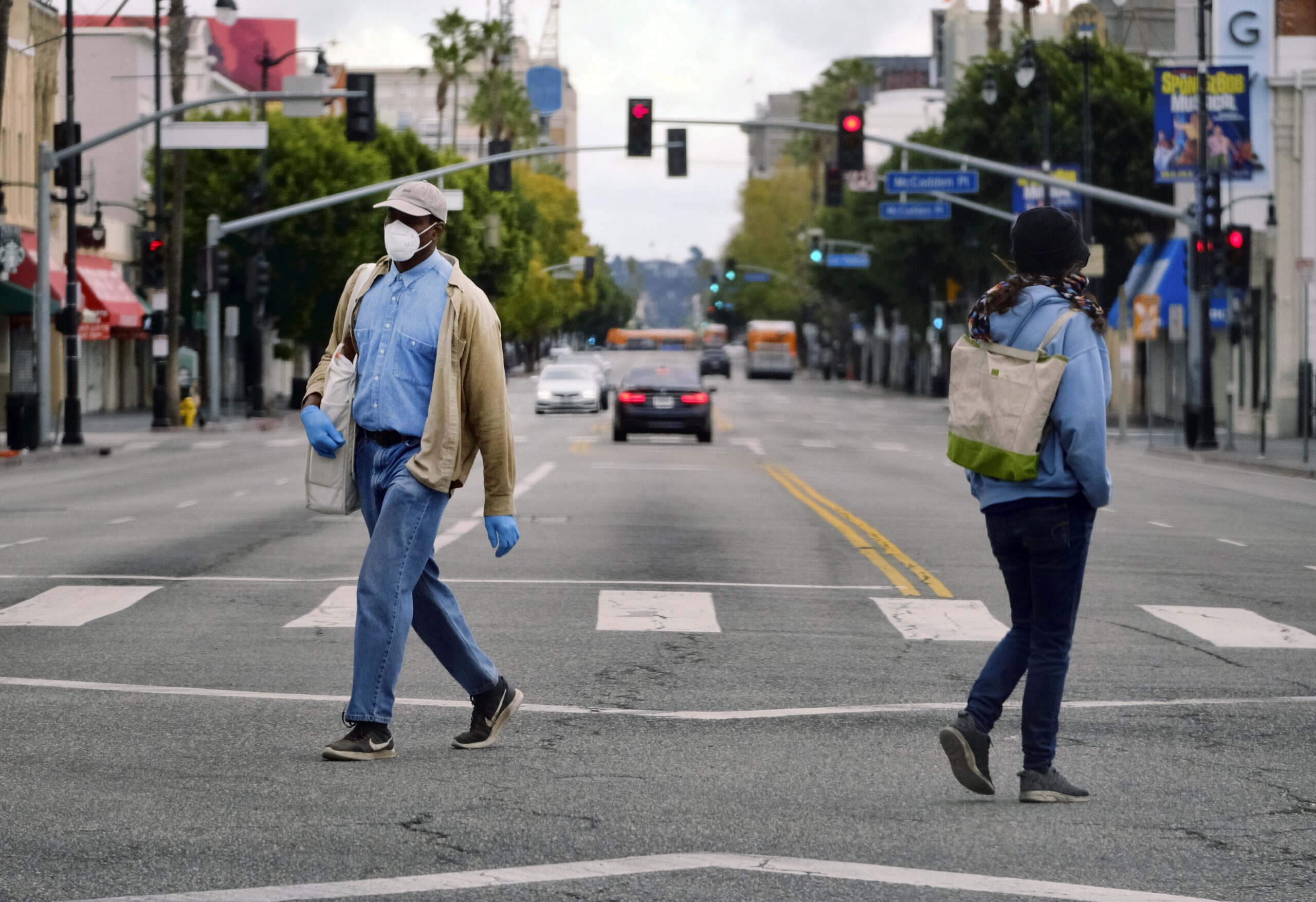 Pedestrians wearing protective masks