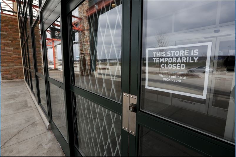 A store closed sign on Dick's Sporting Goods