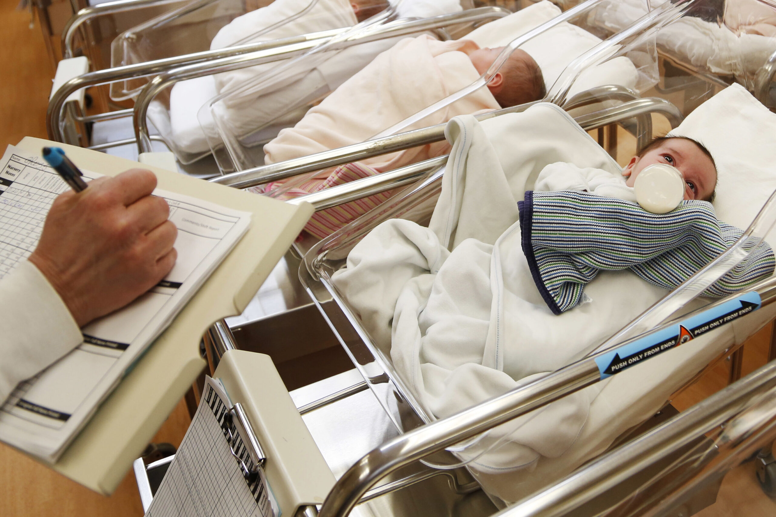 newborn babies in the nursery of a postpartum recovery center