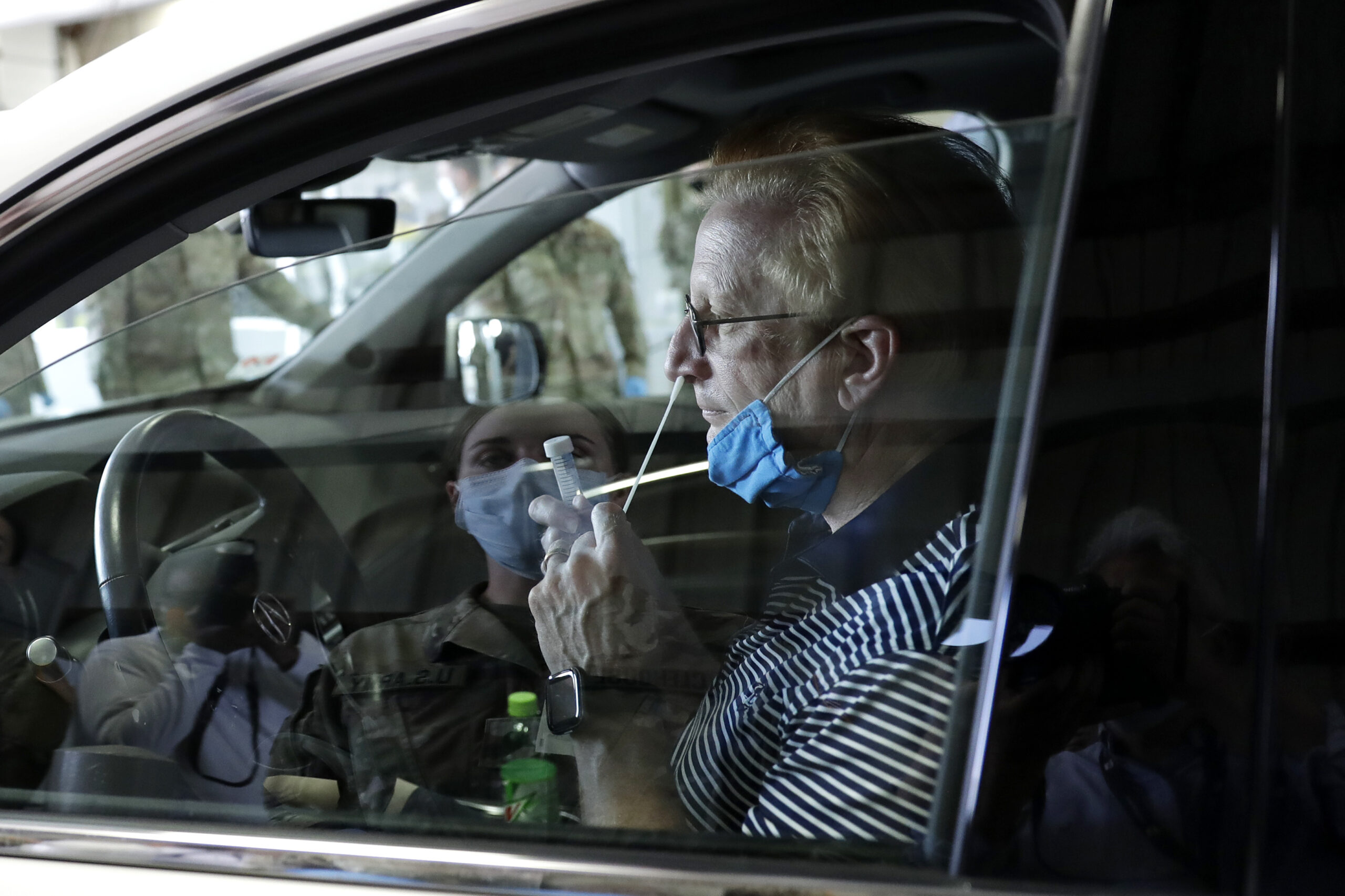 Wayne Taylor gets a free drive-thru COVID-19 test at the testing facility in Waukegan, Ill.