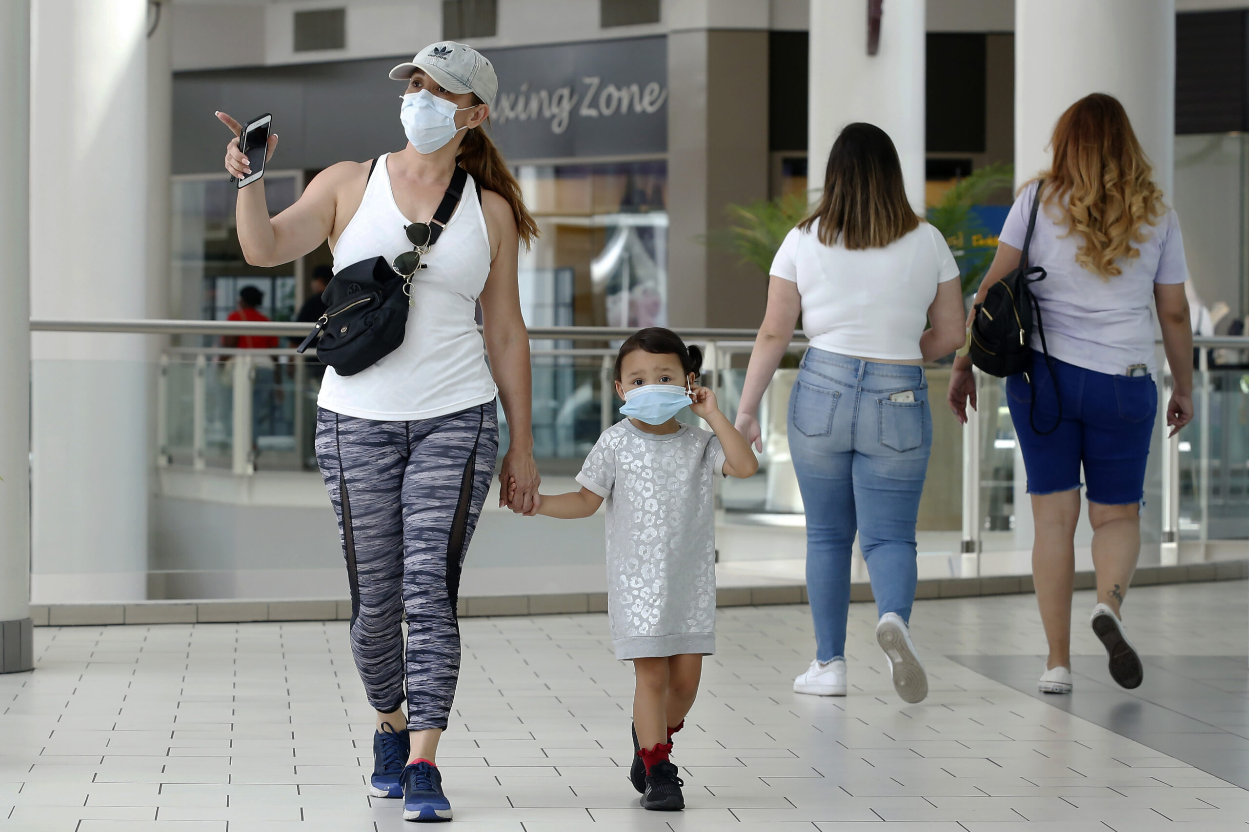 Family walking in mall.