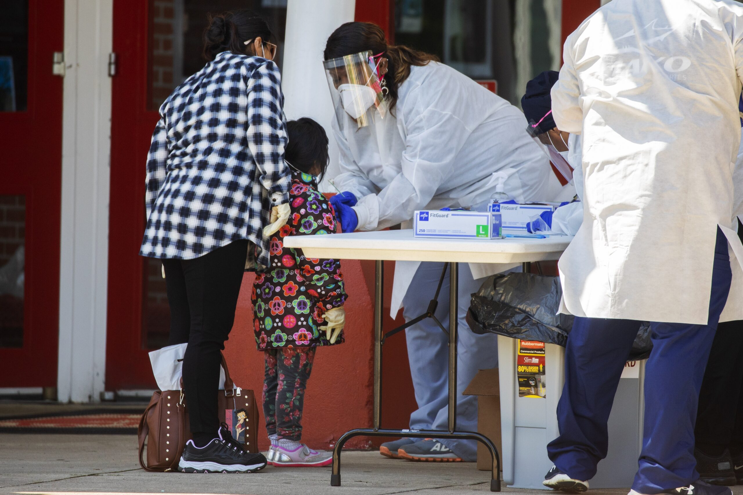 A little girl is tested for COVID-19