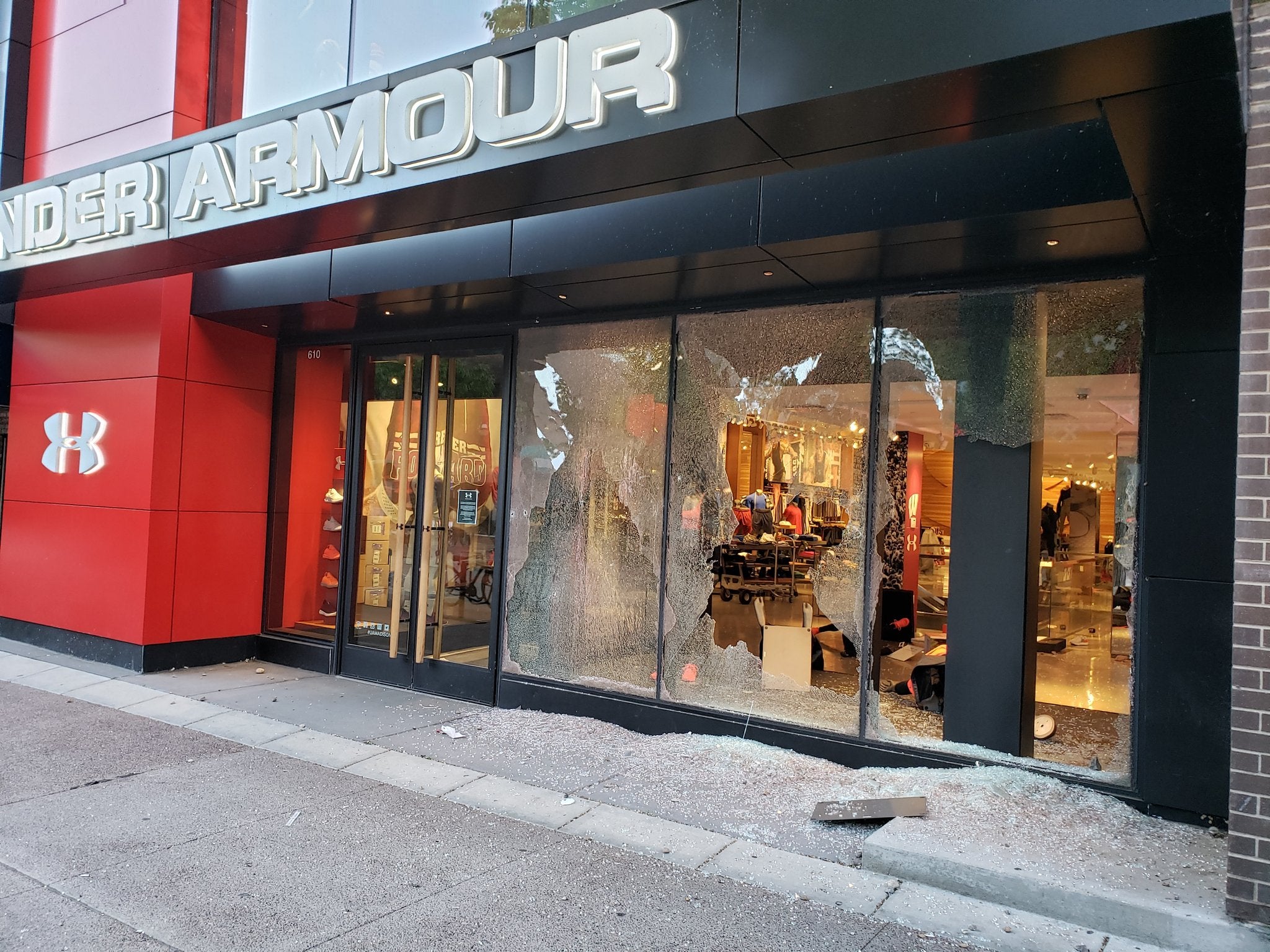 Store windows broken on State Street in downtown Madison early Saturday evening.