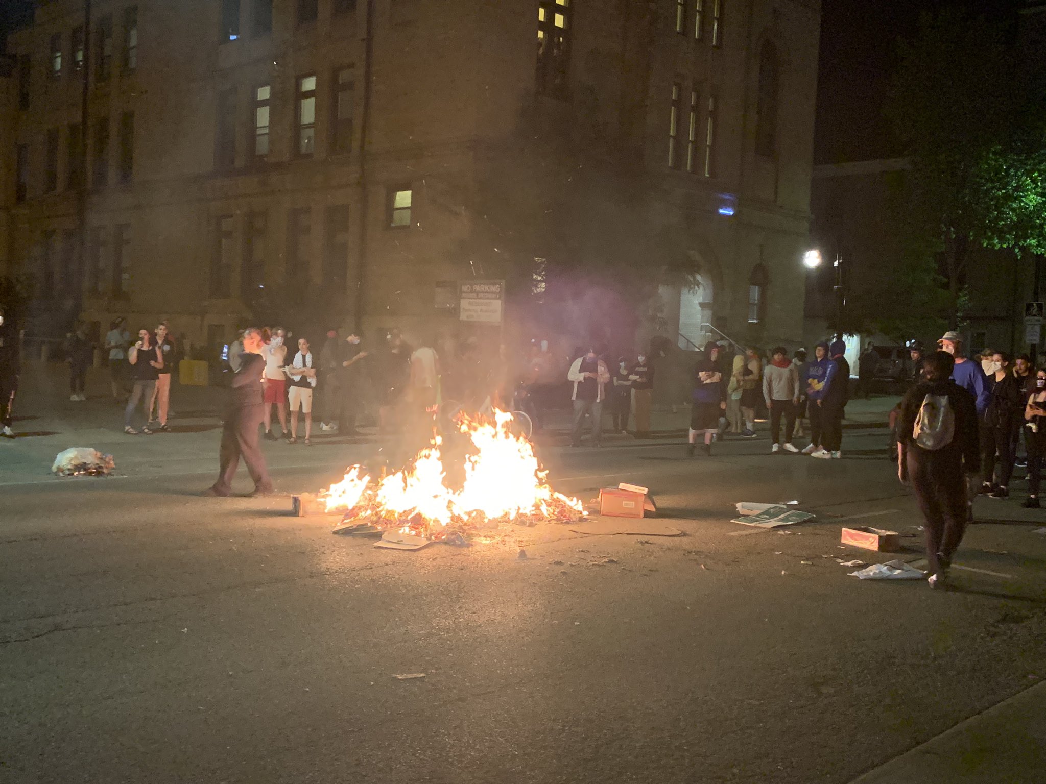 A trash fire in the middle of Johnson Street in downtown Madison on Saturday night.