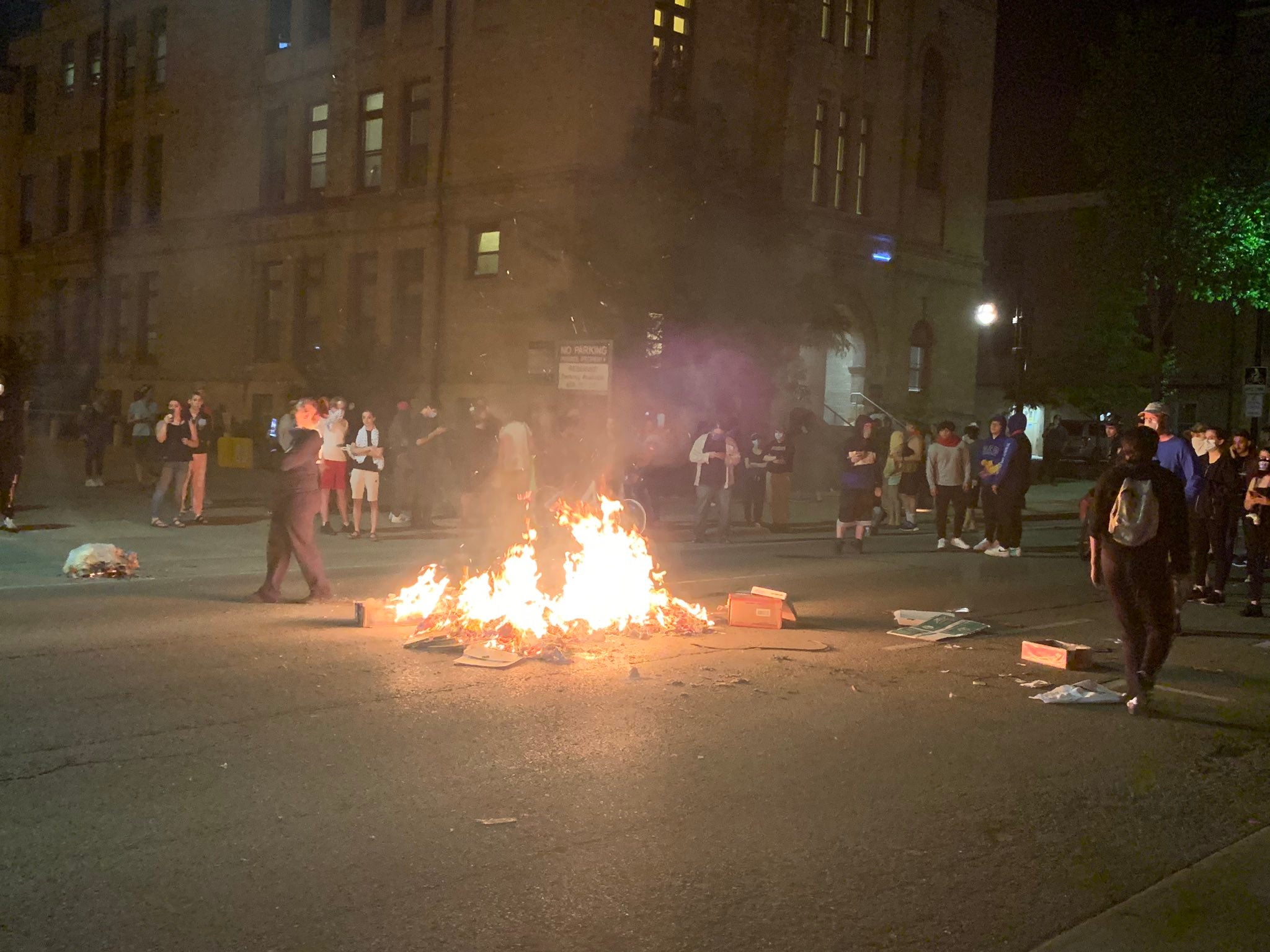 A trash fire in the middle of Johnson Street in downtown Madison on Saturday night.