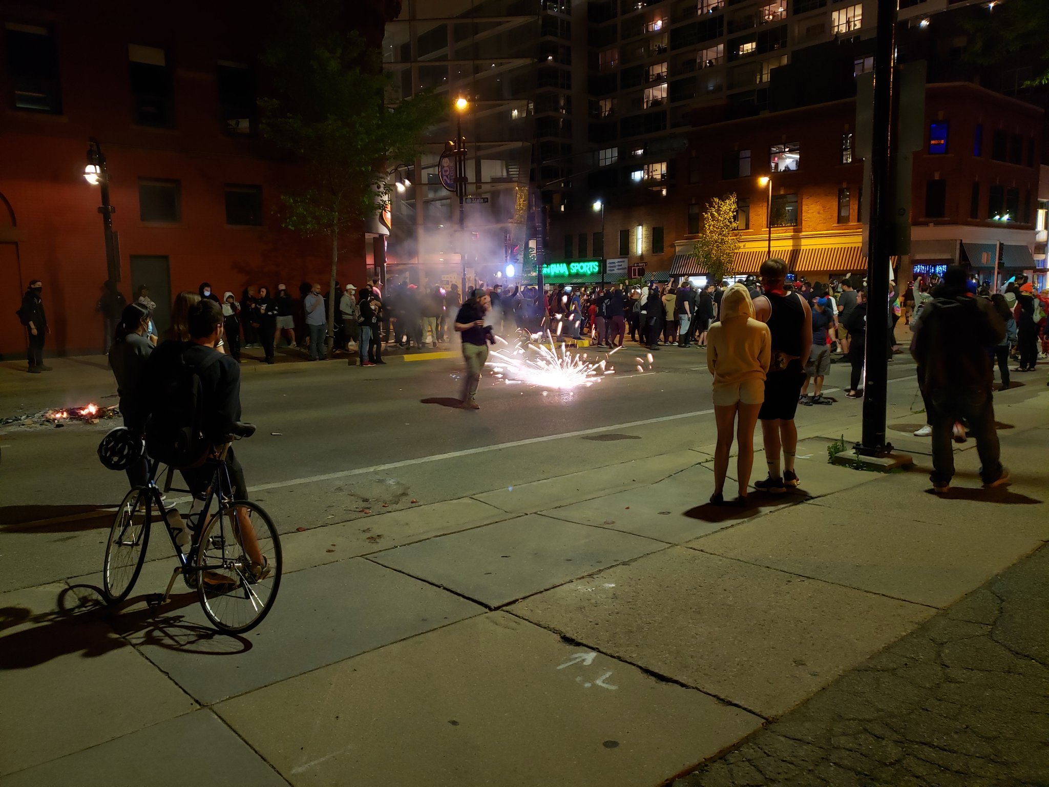 Protesters face off against police Saturday night in downtown Madison.