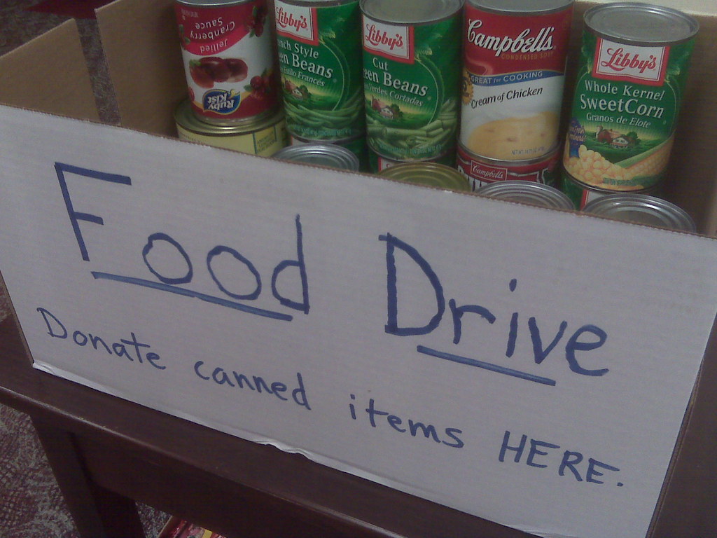 Food drive sign and canned goods