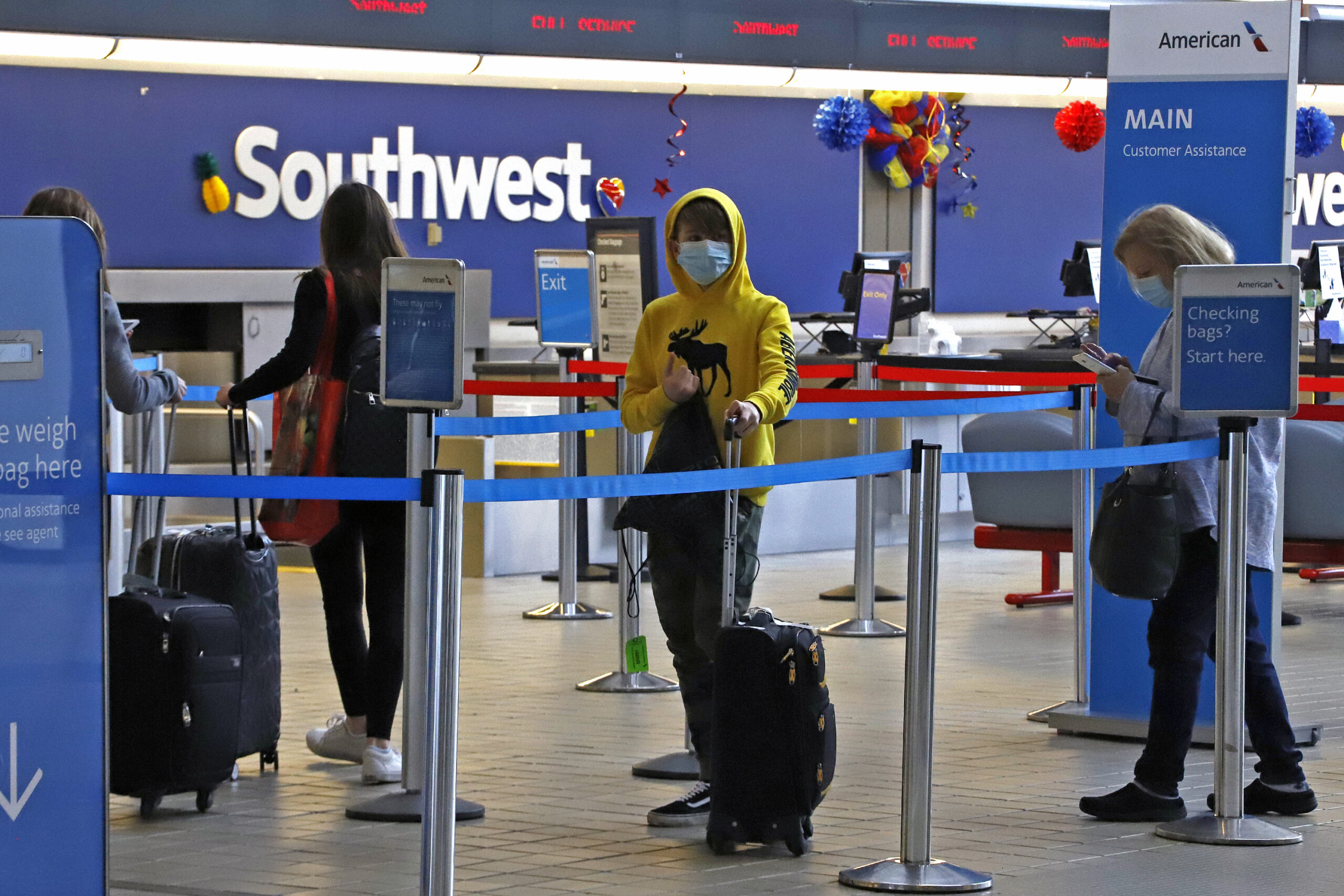 Travelers take coronavirus precautions at airport