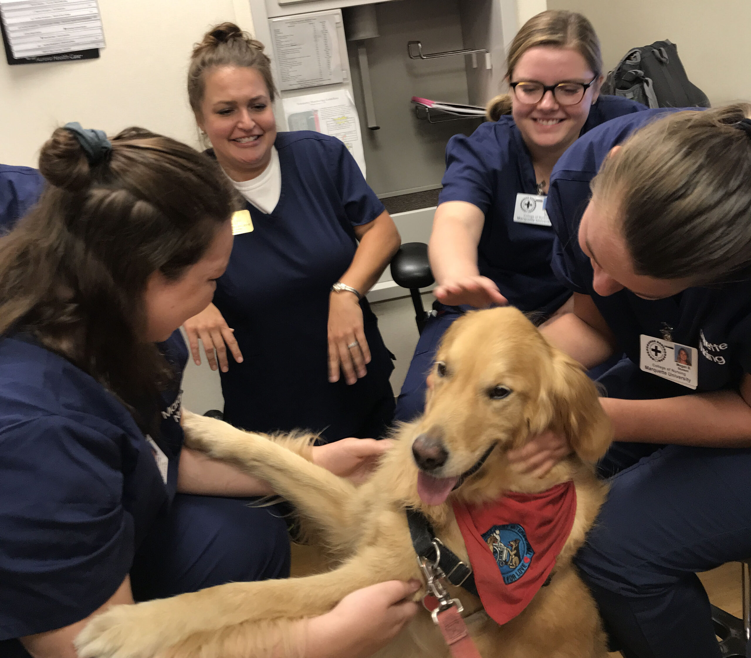 Nursing staff at Aurora St. Luke's Hospital in Milwaukee with Hannah the therapy dog.