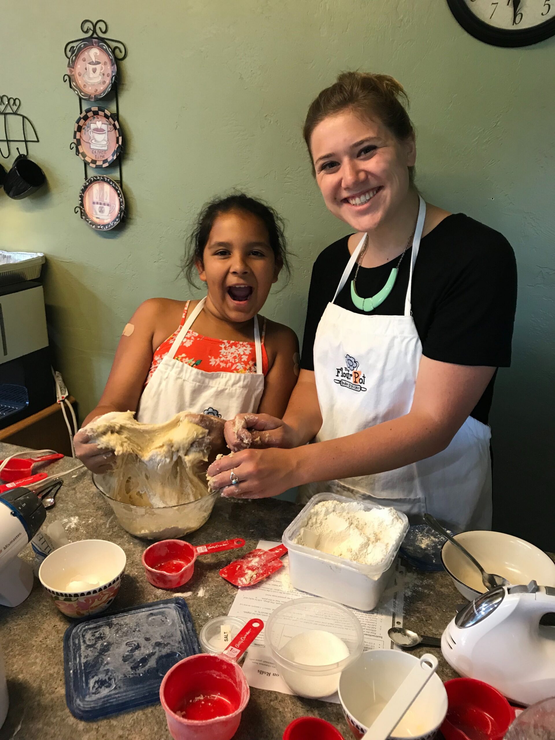 Big Katie Hermsen and her Little Angelina pose with dough while baking