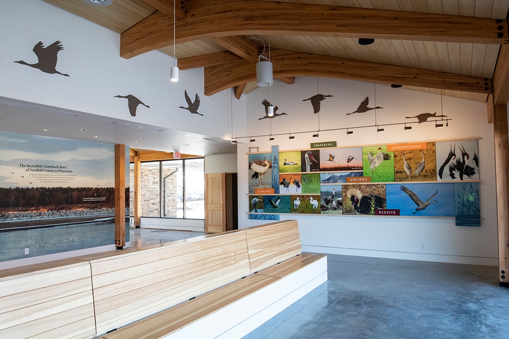 Pictured is the indoor viewing area for the sandhill crane exhibit that includes images and information about all 15 crane species