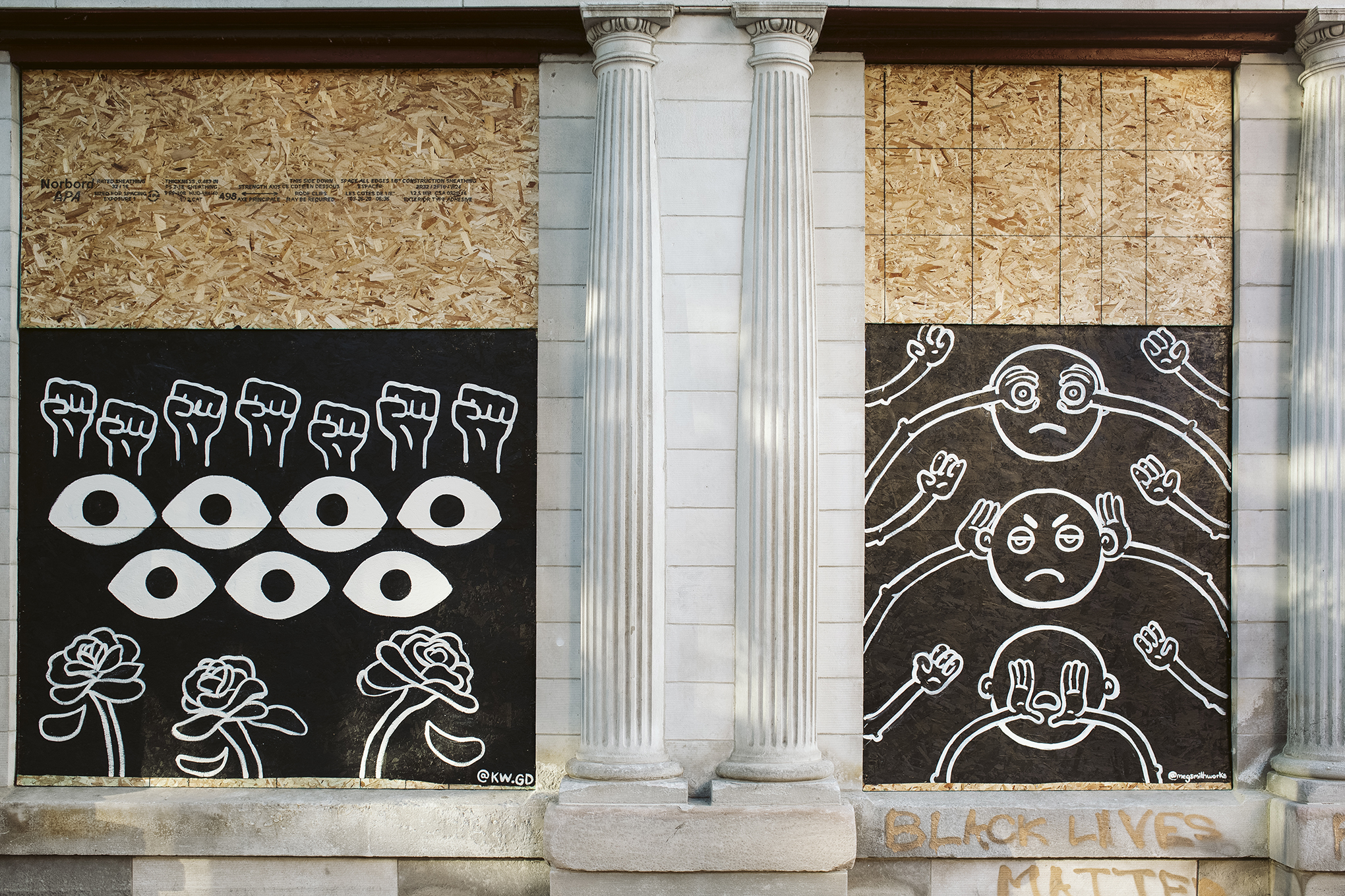 Artwork is displayed on boarded up store windows on State Street