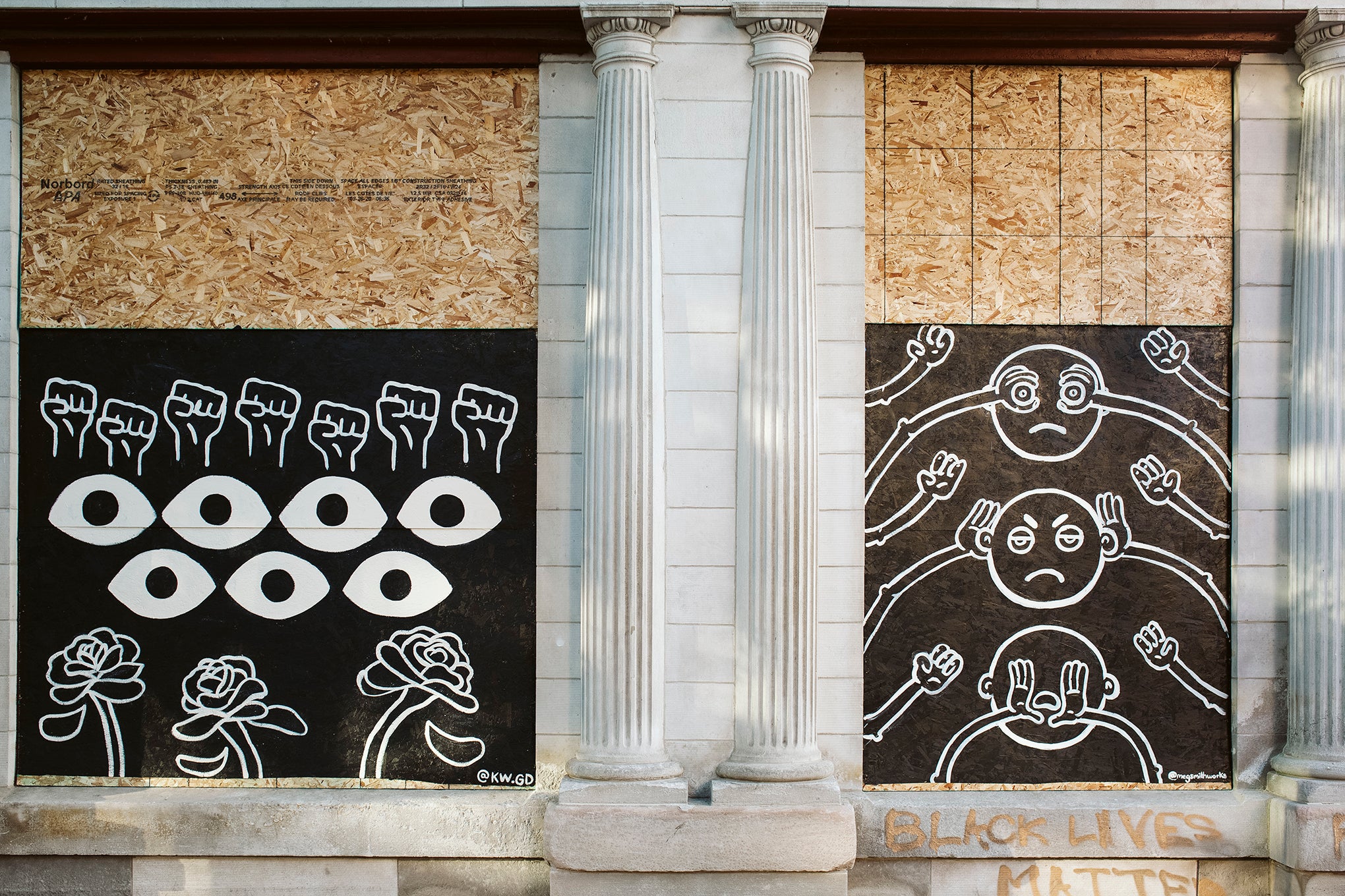 Artwork is displayed on boarded up store windows on State Street