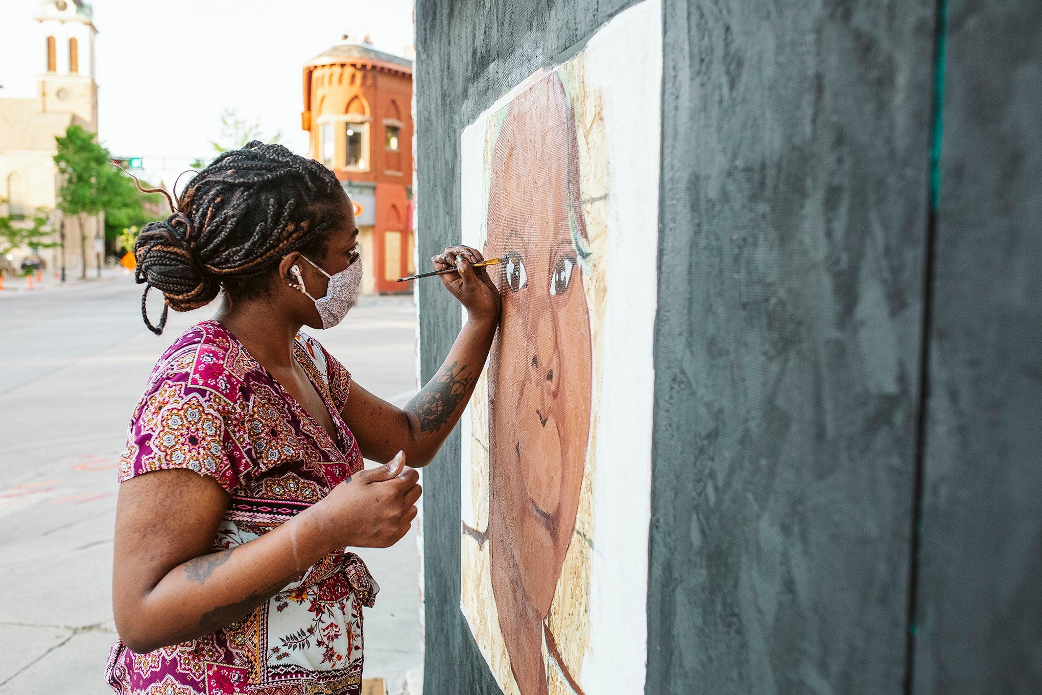 Artist Cassie Pierce paints a mural on Short Stack Eatery