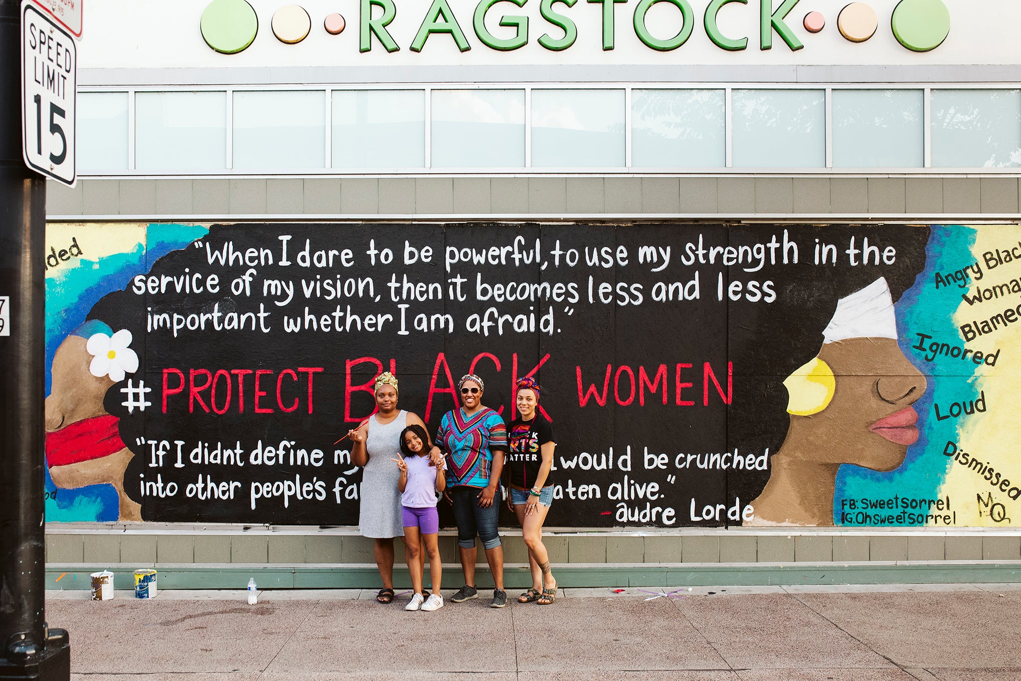 Maia Pearson, Cassandra Marzette and ChaNelle Baines work on a collaborative mural on Ragstock