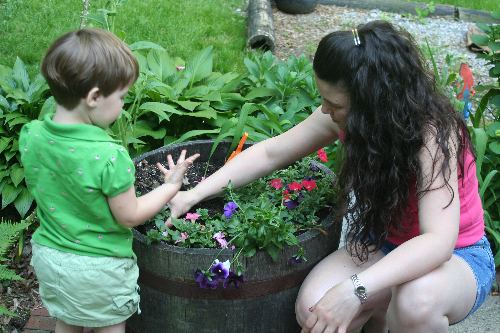 Child gardening with adult