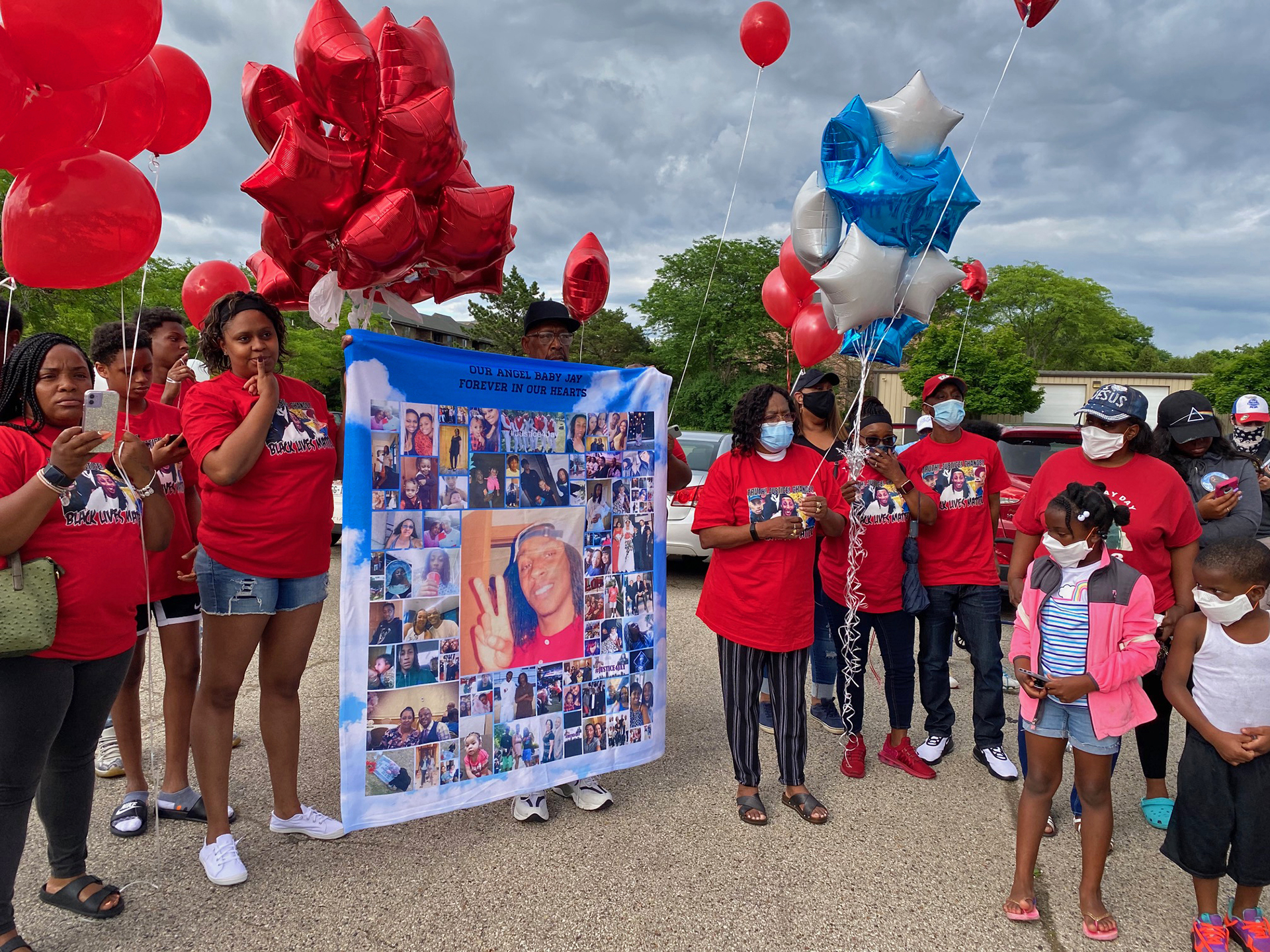 Community members gather at a balloon ceremony on the fourth anniversary of Jay Anderson Jr.'s death