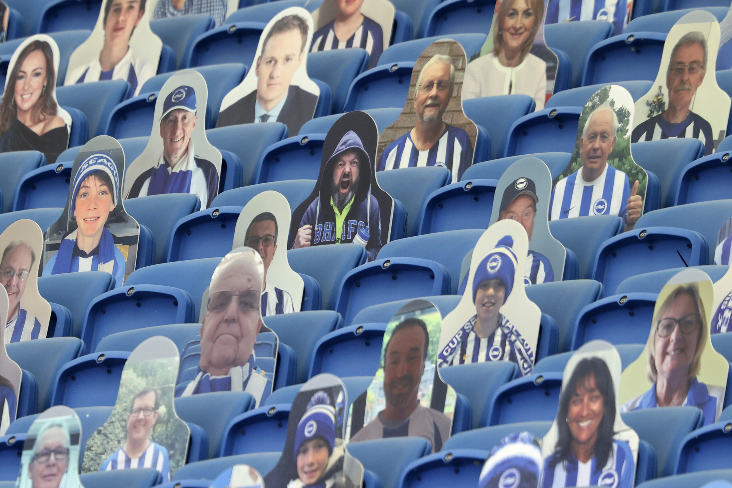 Fan cutouts at an English Premier League soccer game