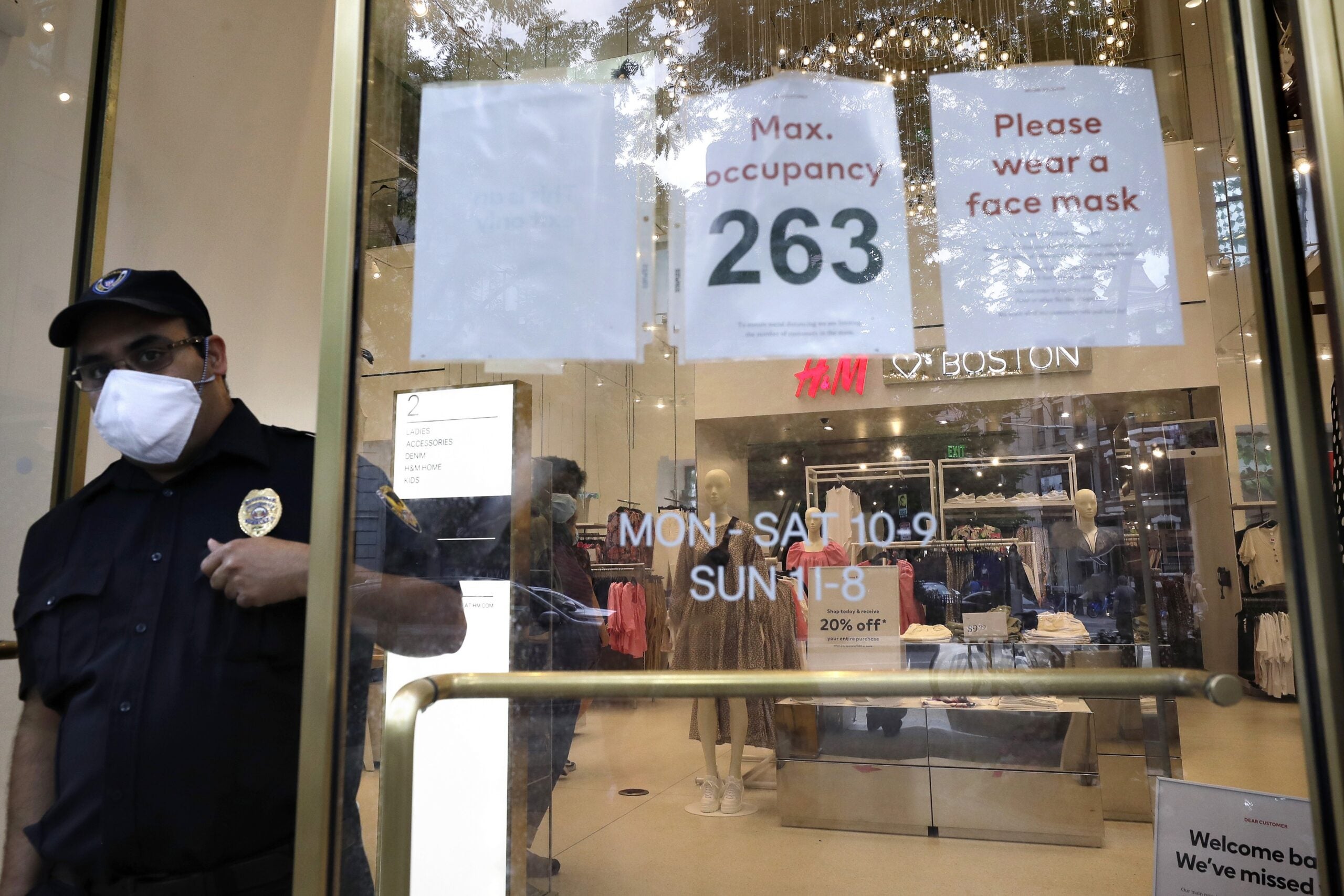 A man shops at a retail outlet in a face mask.