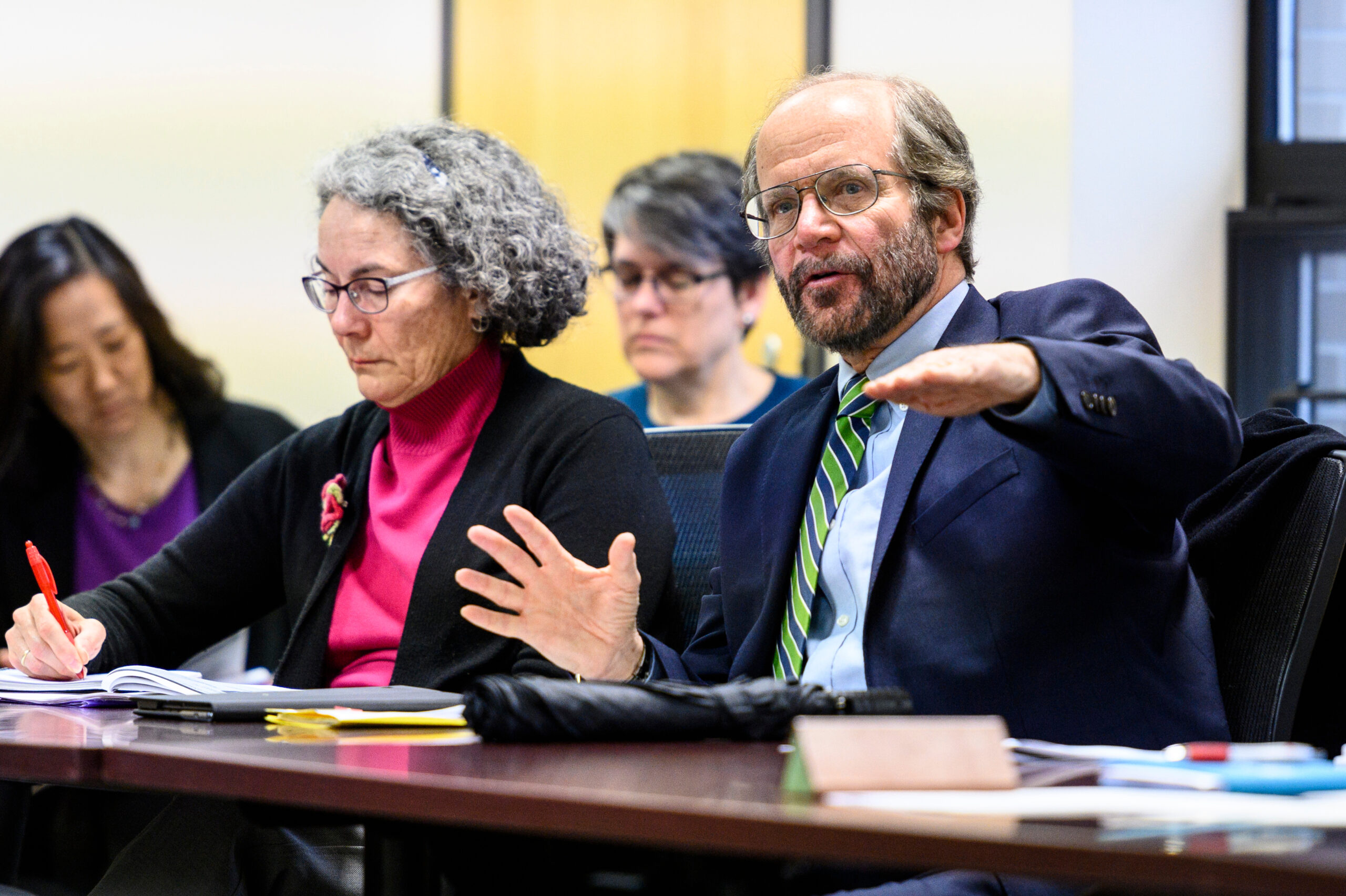 The dean of the School of Medicine and Public Heath, speaks during a Deans Council meeting
