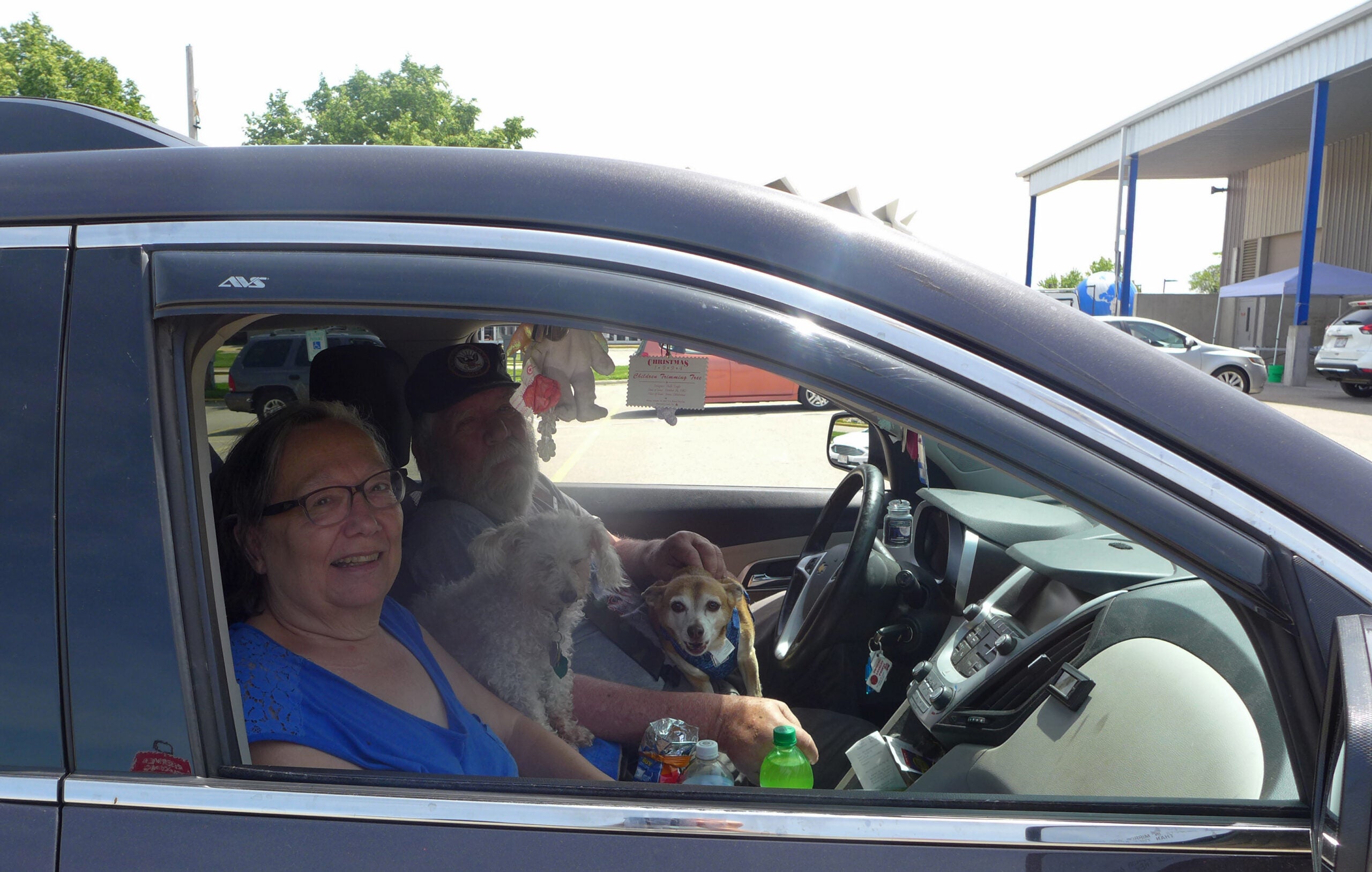 Glen and Delores Turner wait for free COVID-19 testing at the Alliant Energy Center