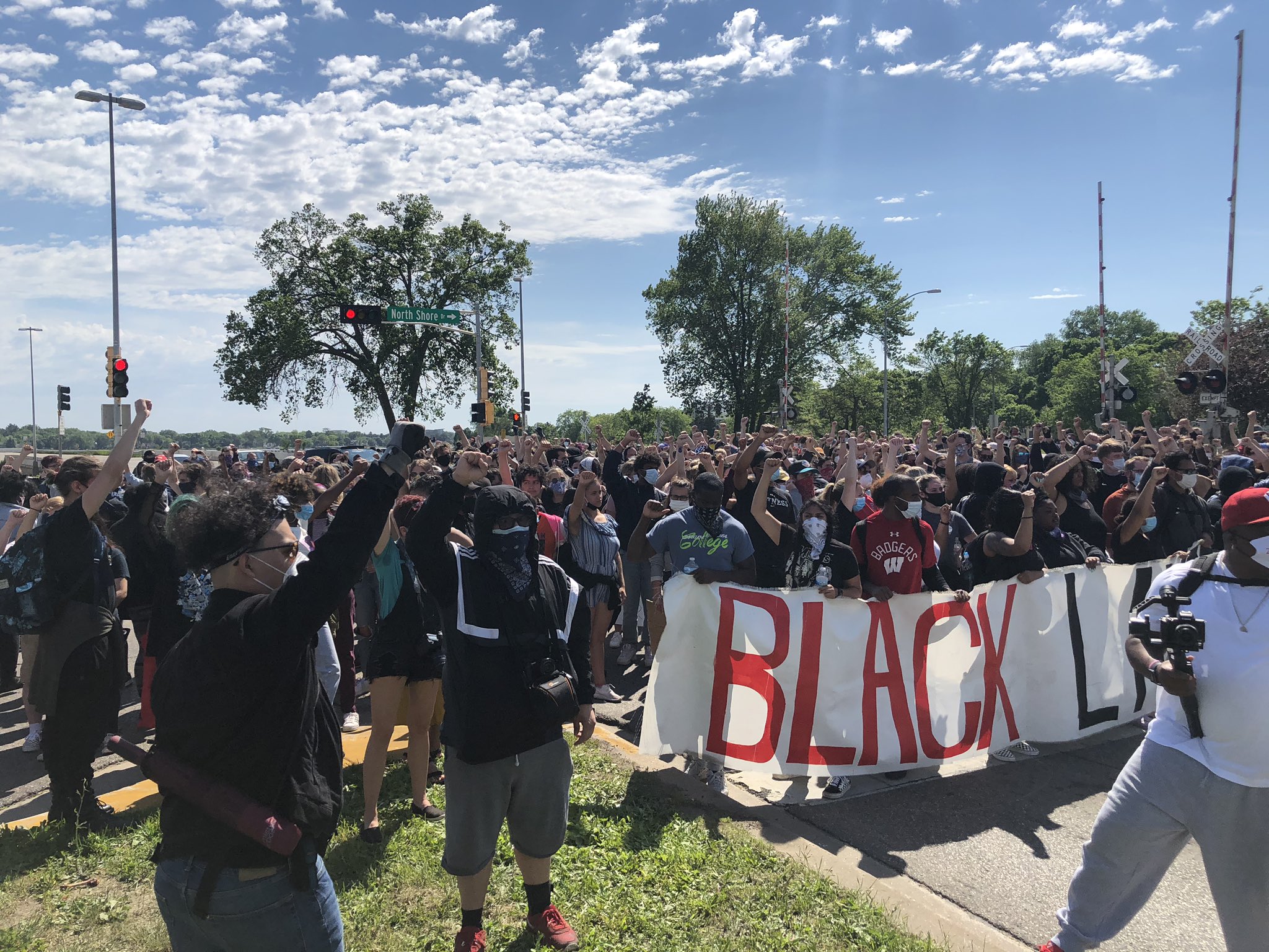 Protesters rallied on John Nolen Drive in Madison on Monday afternoon.