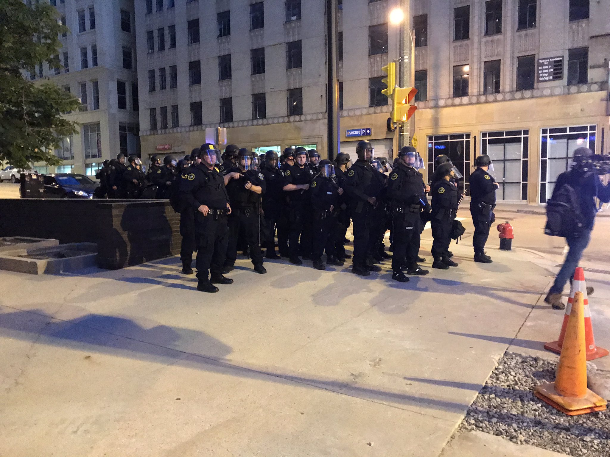 Police assemble close to the start of the citywide curfew on Monday night, June 1, 2020.