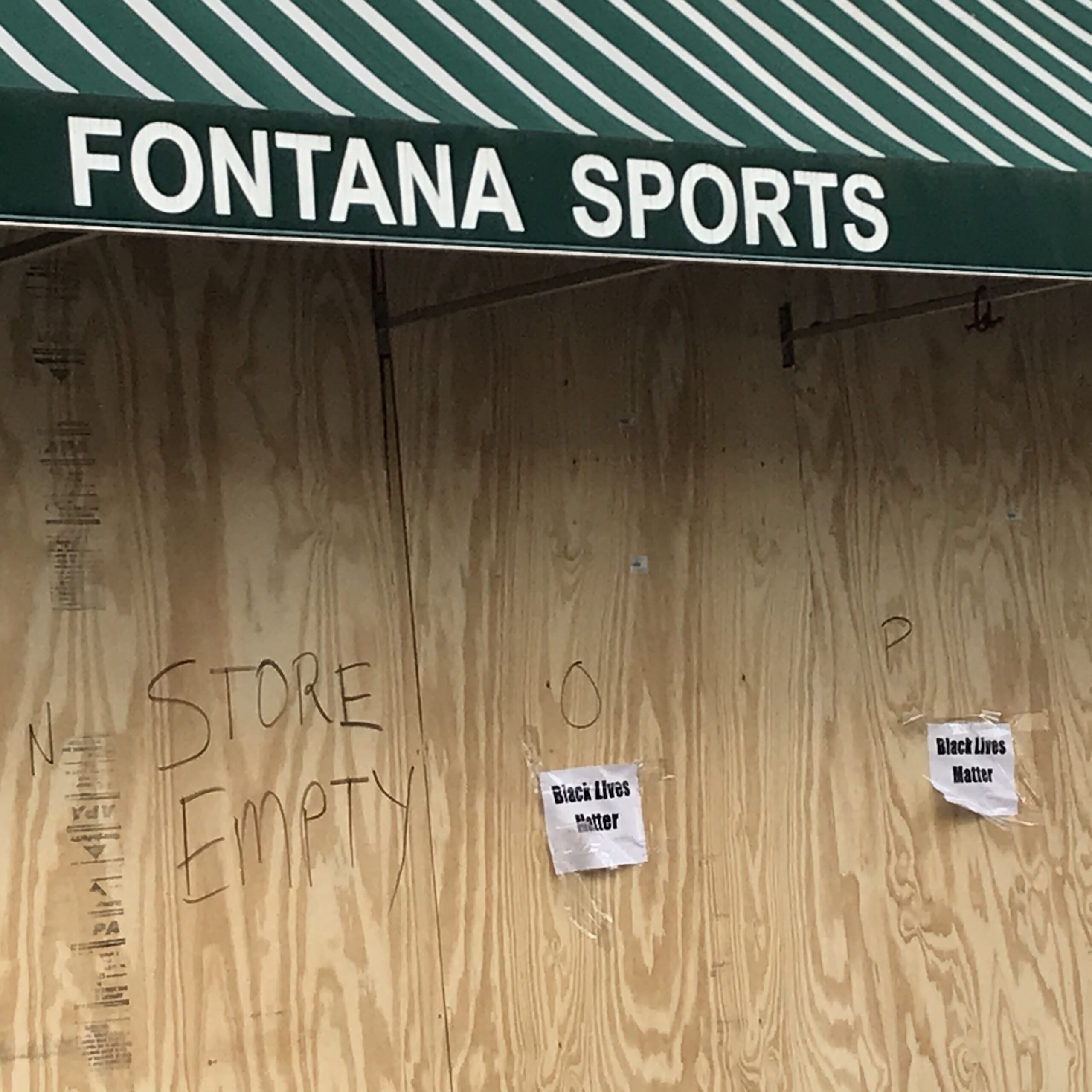 Signs supporting the Black Lives Matter movement are posted on downtown Madison storefronts