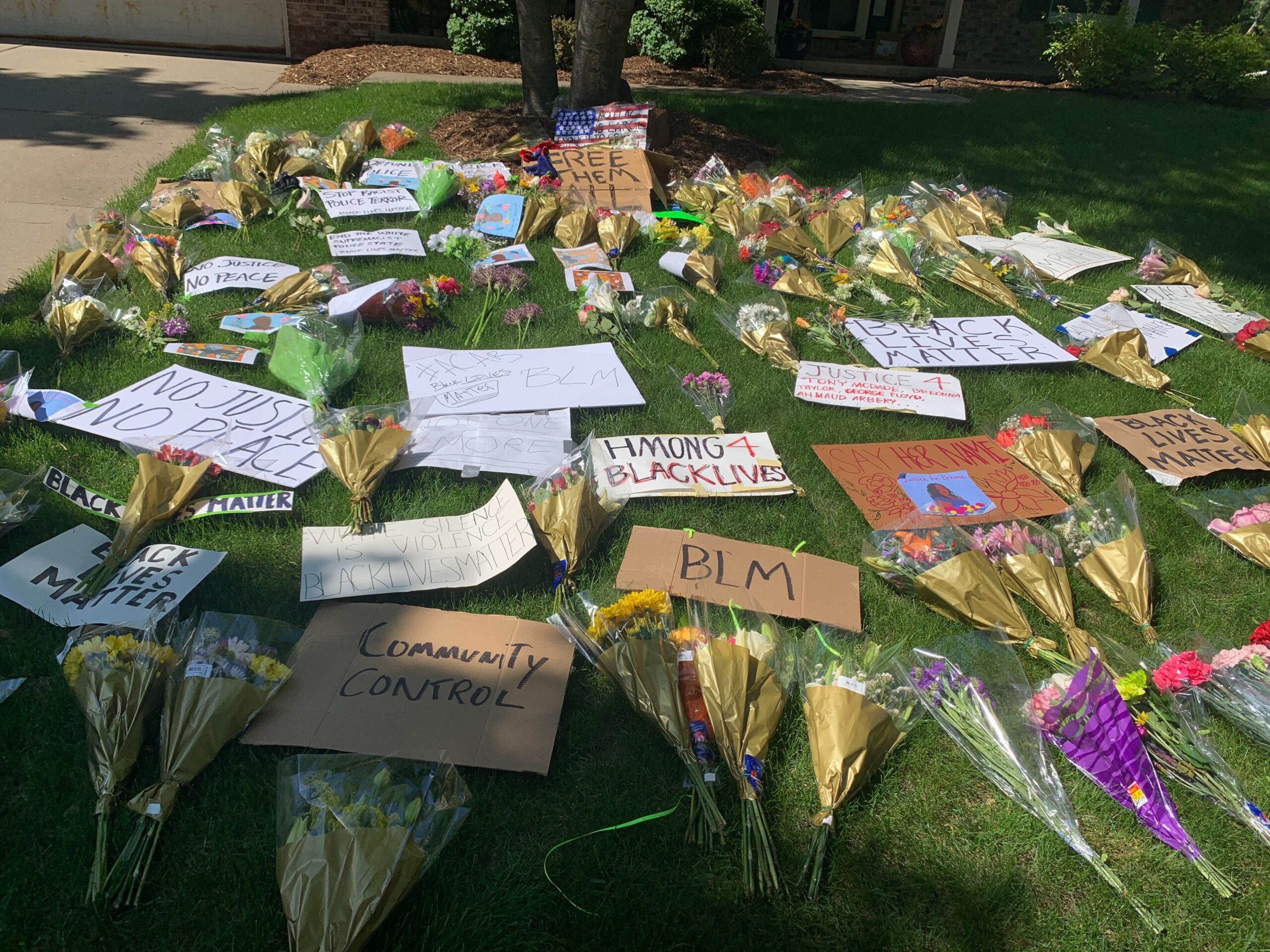 Flowers, signs and pictures placed outside Dane County Sheriff Dave Mahoney's home