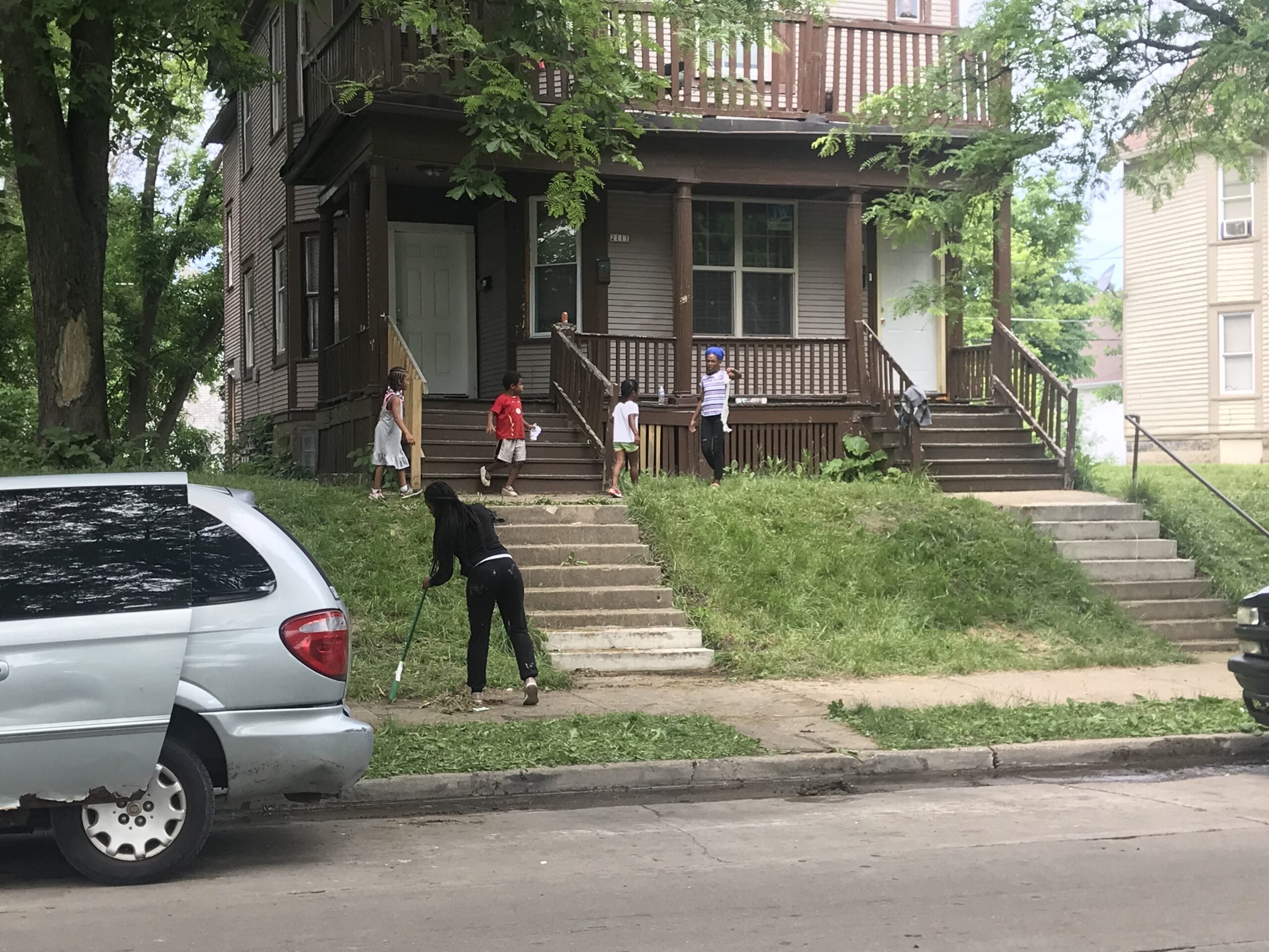 Milwaukee resident Epiphany Conner brought a broom and trash bags to North 40th street and West Lloyd Street.
