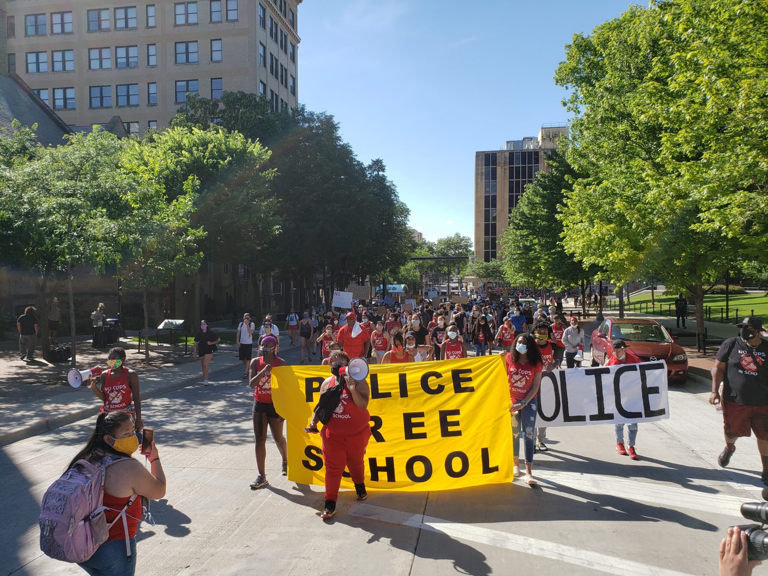 Activists march with Police Free Schools banner