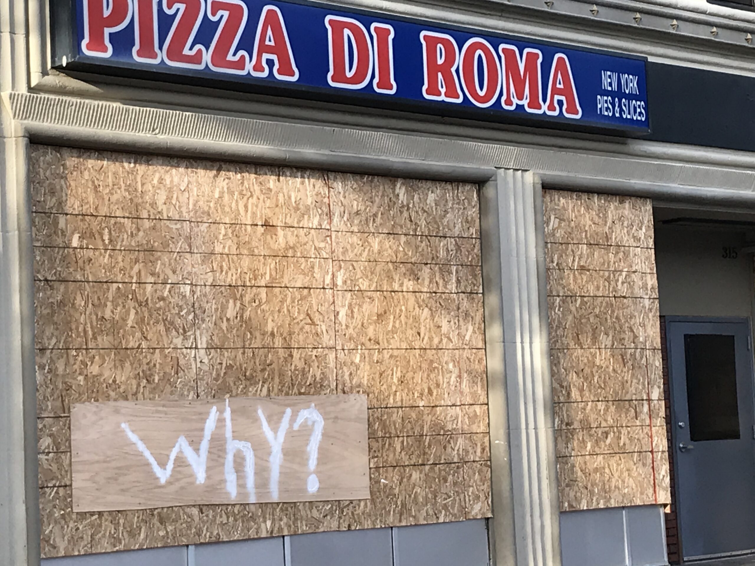 Storefronts on State Street in downtown Madison are boarded up