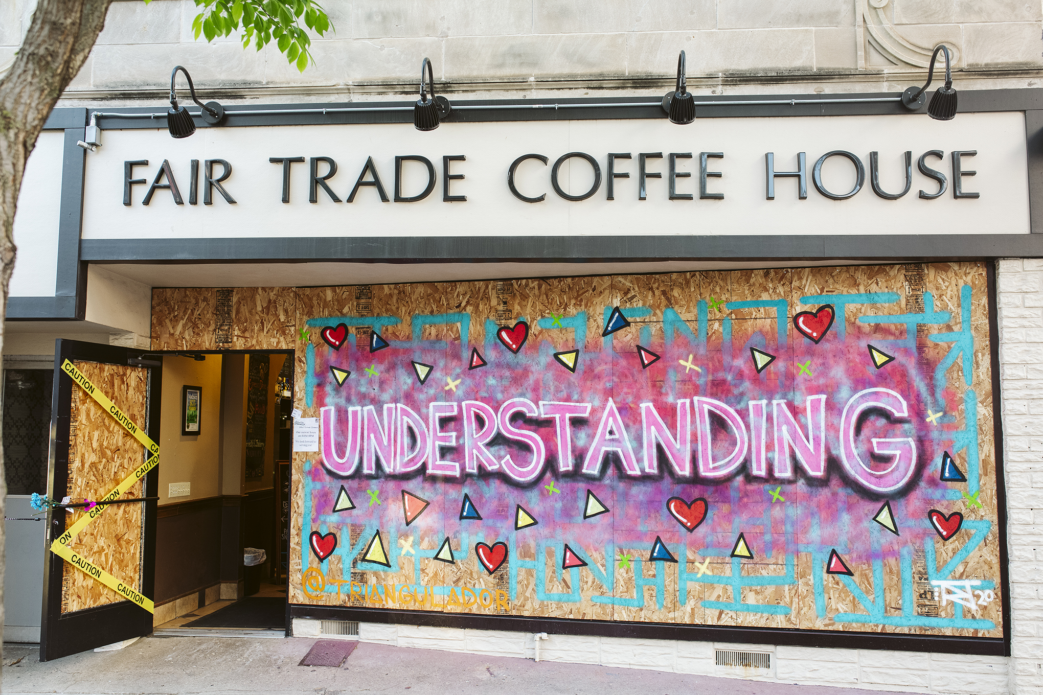Madison street artist, Triangulador's artwork is displayed on Fair Trade Coffee House
