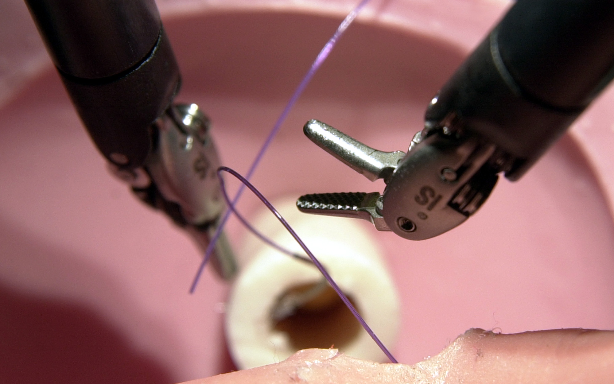 The tiny hands of a surgical robot are used for precision stitching during a demonstration at Maine Medical Center in Portland, Maine.