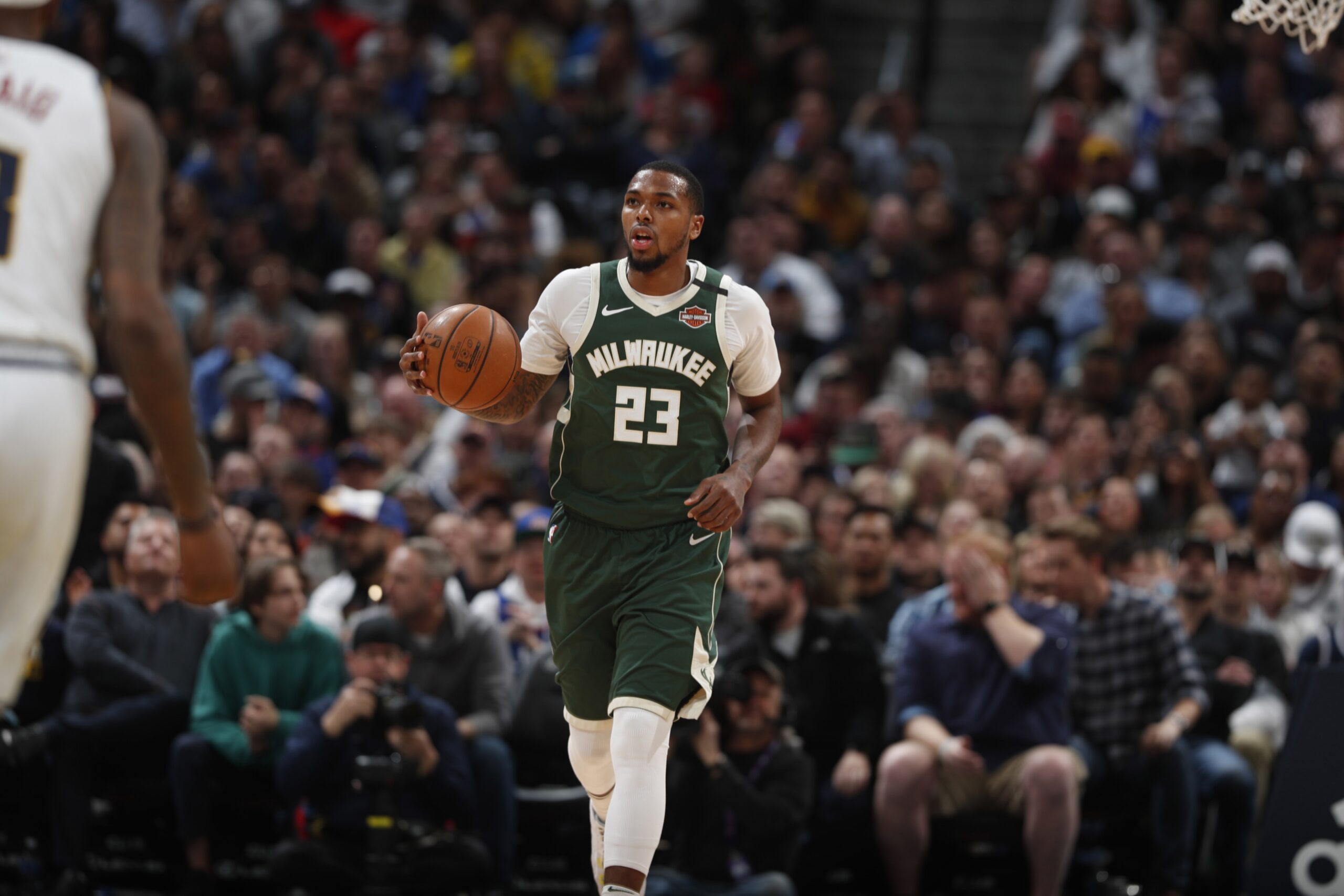 Sterling Brown dribbles the ball