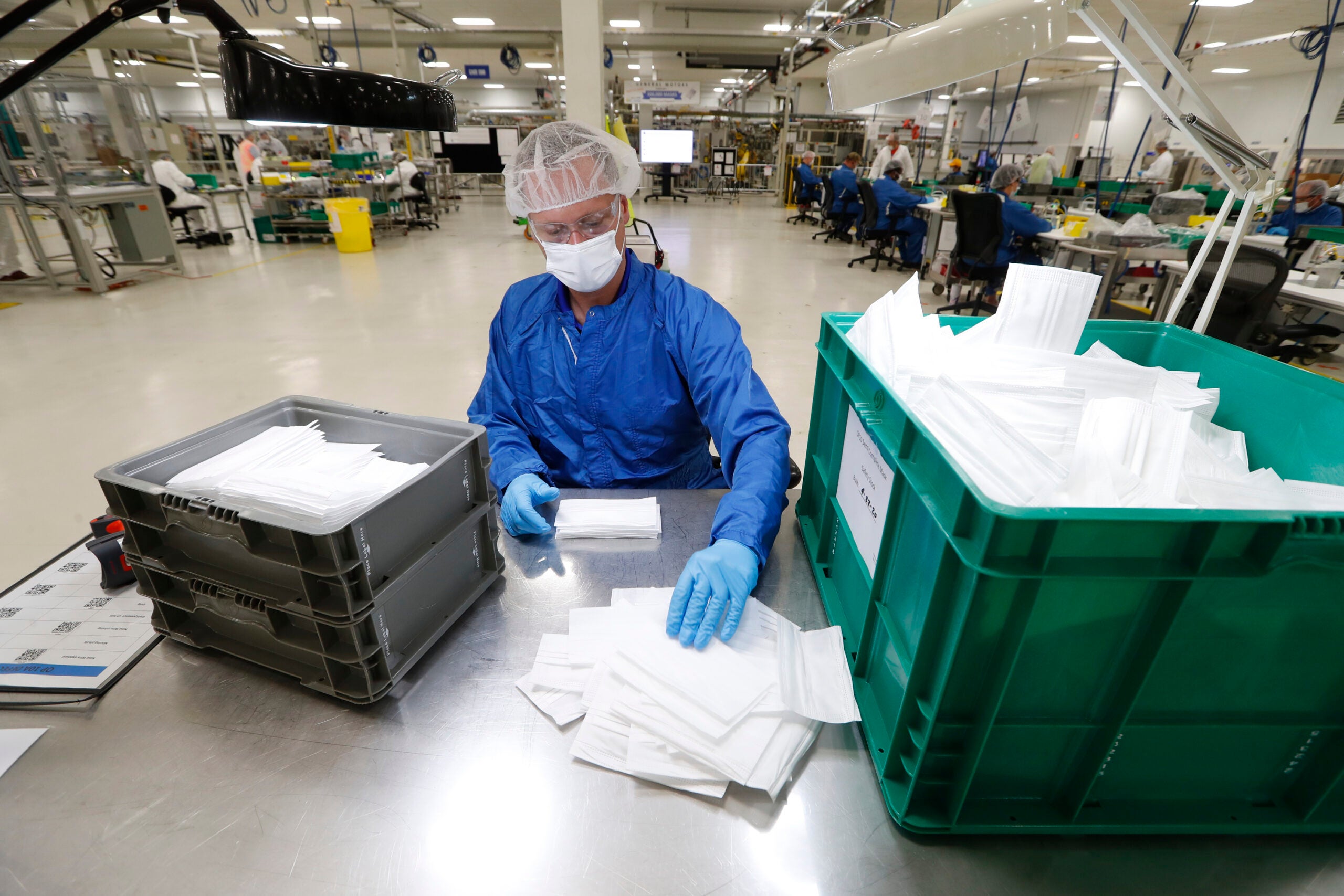 Worker manufacturing protective masks