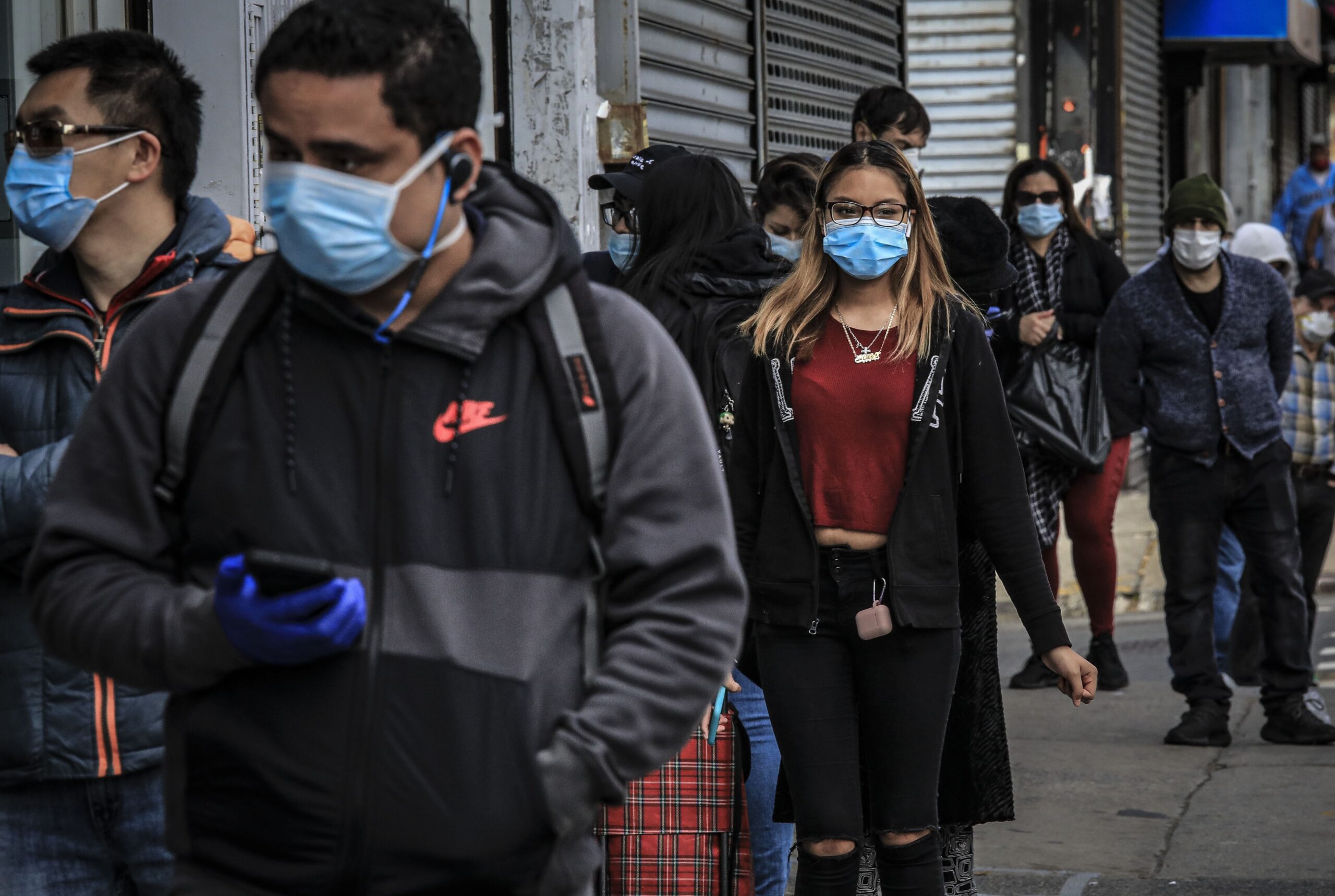 People in Brooklyn's Sunset Park wear masks to help stop the spread of coronavirus