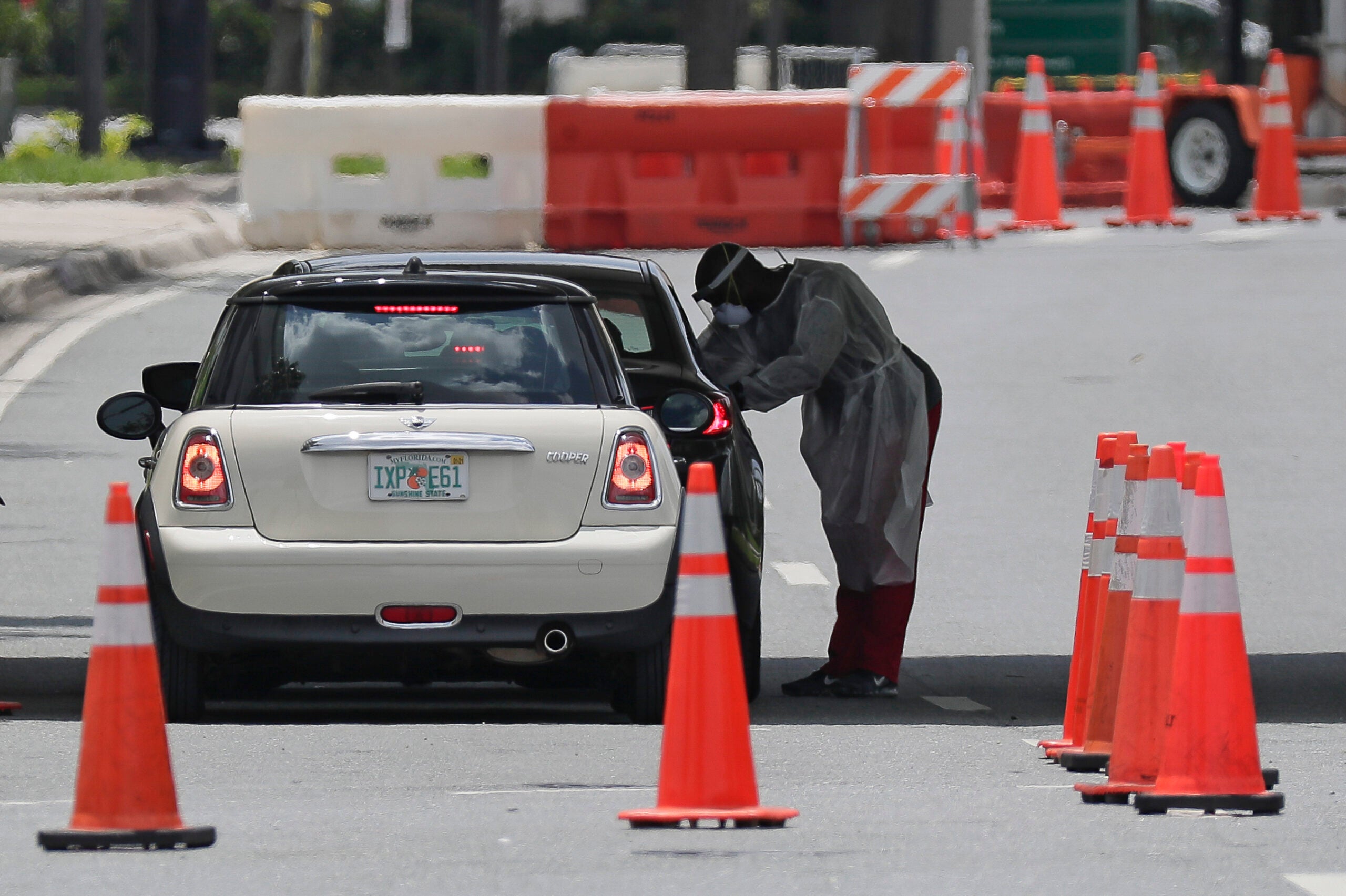 A health worker performs a COVID-19 test