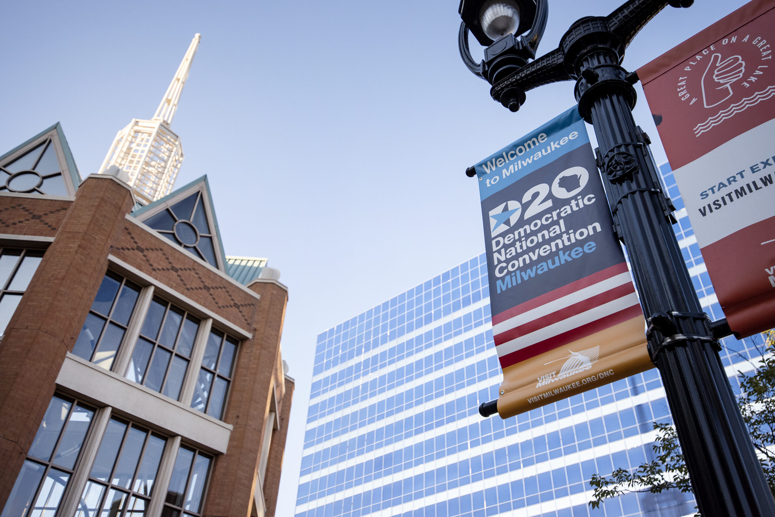 a sign on a lamp post advertises the DNC in Milwaukee