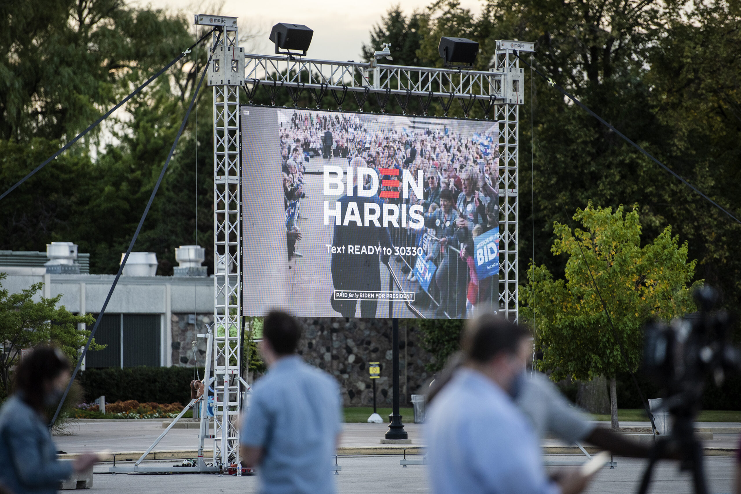 A large screen shows the words 