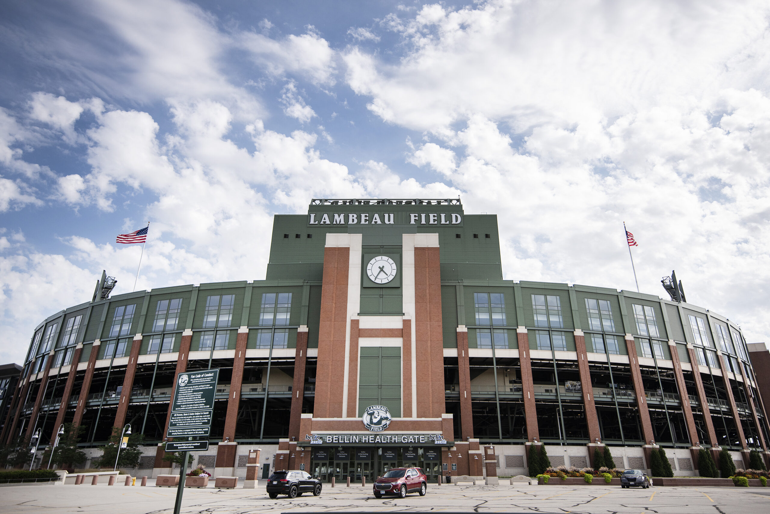 Clouds and a blue sky can be seen behind Lambeau Field