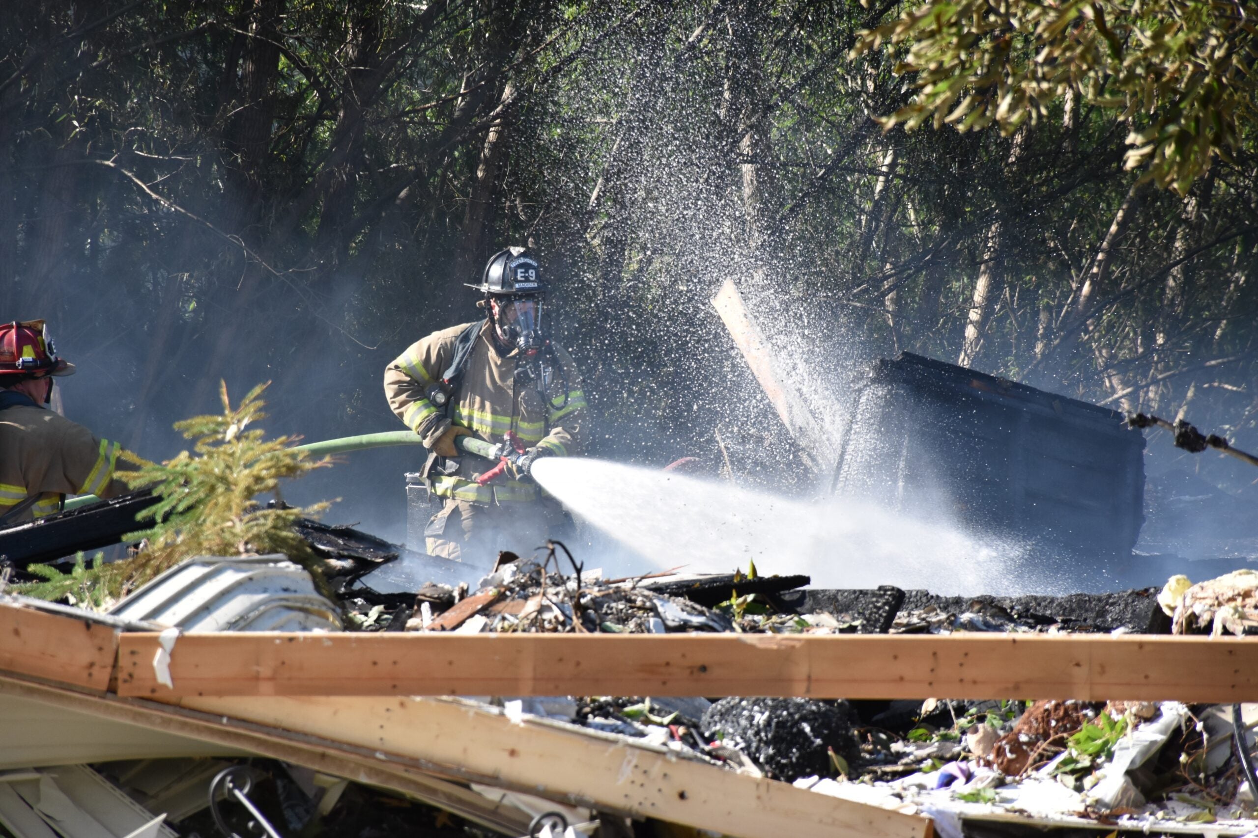 Madison Fire Department firefighters battle a house explosion