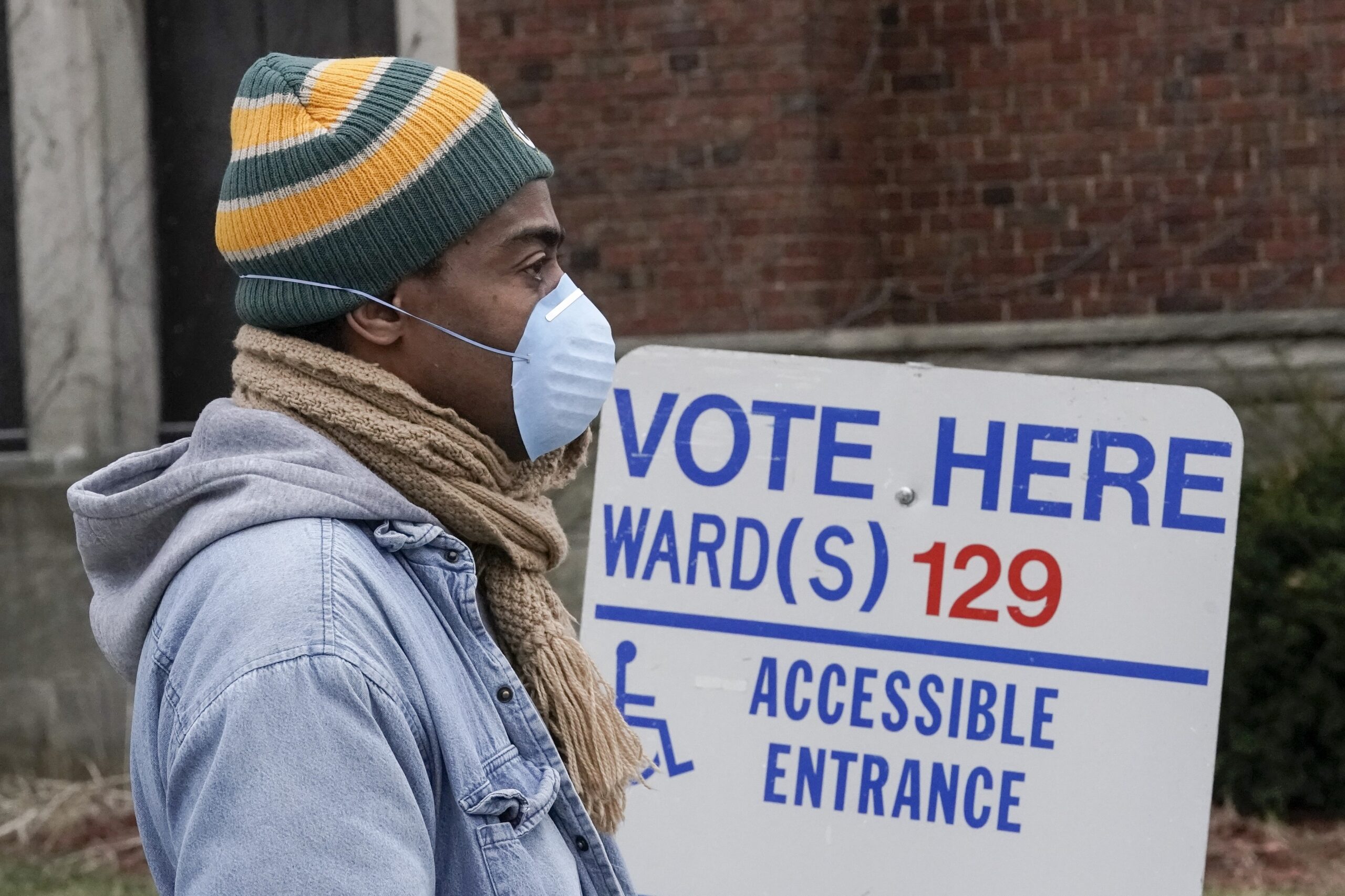 Voters in masks line up for Wisconsin's April primary election