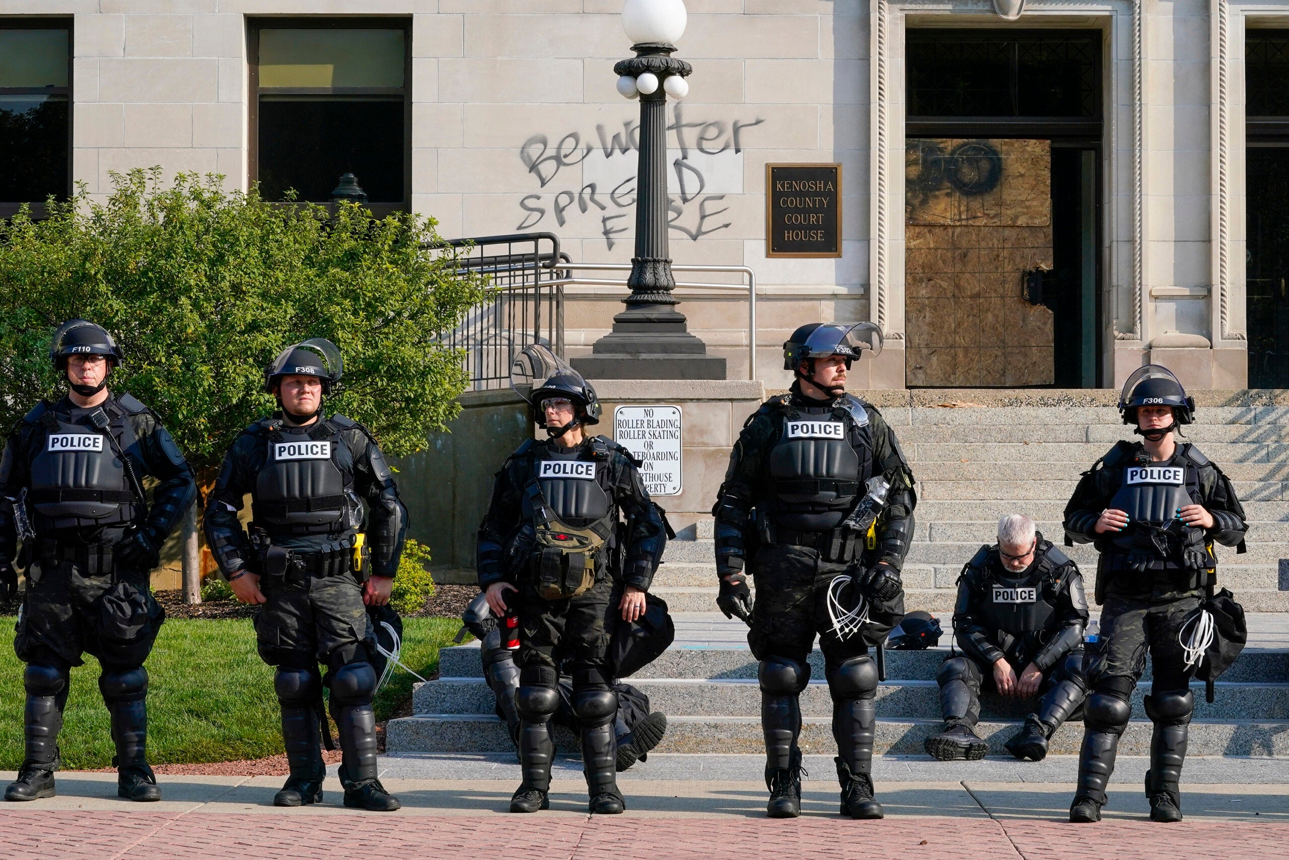 Kenosha Police in the city's downtown, following a night of protest on Aug. 23.