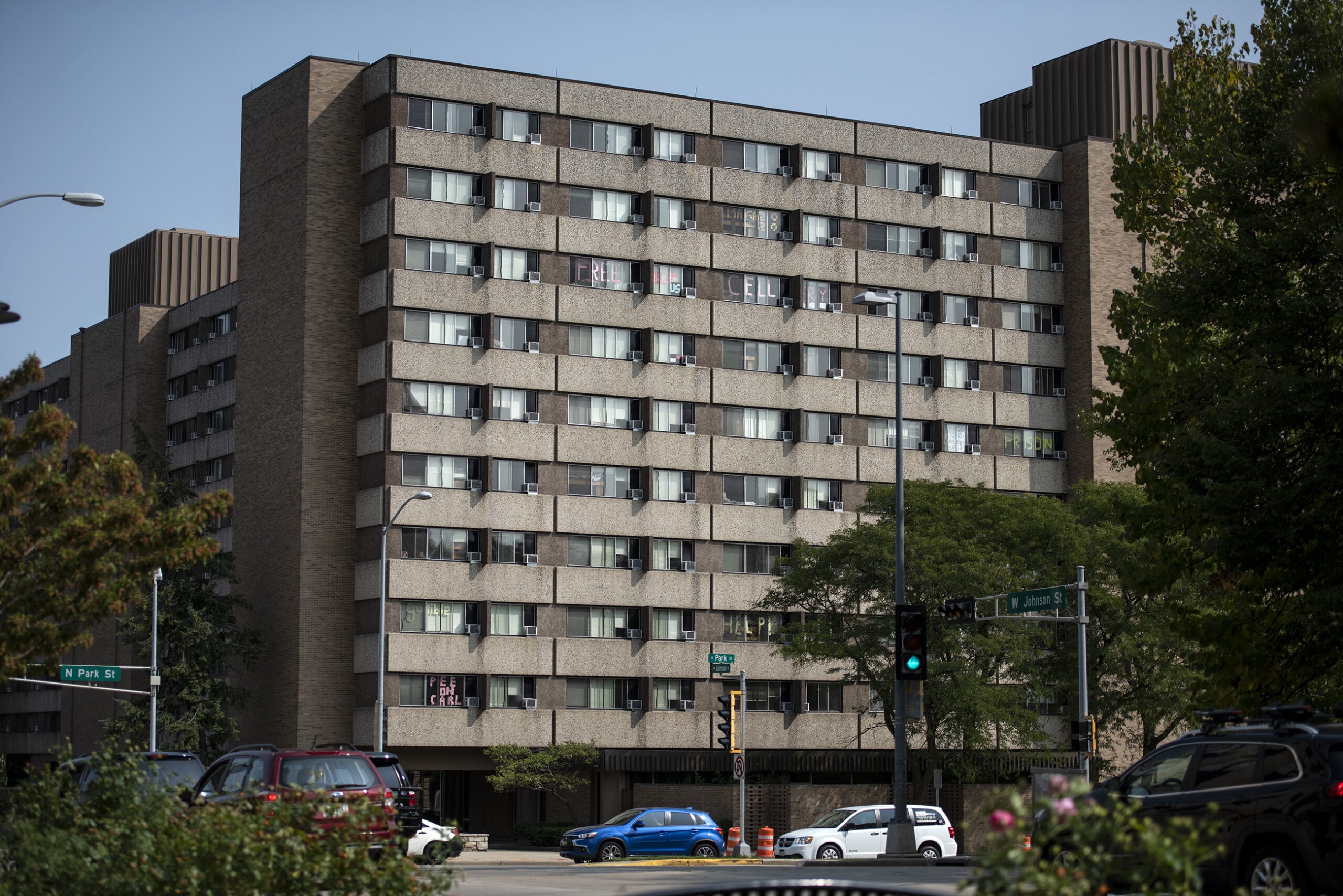 students have used post-it notes to write messages on the windows of the dormitory