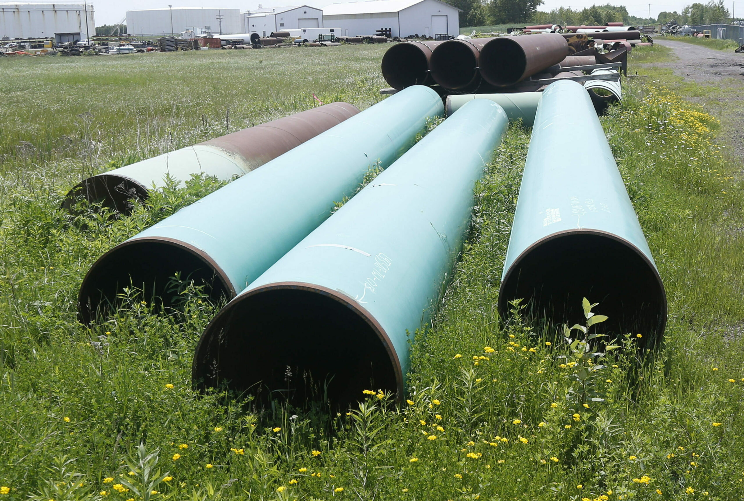 In this June 29, 2018, file photo, pipeline used to carry crude oil is shown at the Superior terminal of Enbridge Energy in Superior