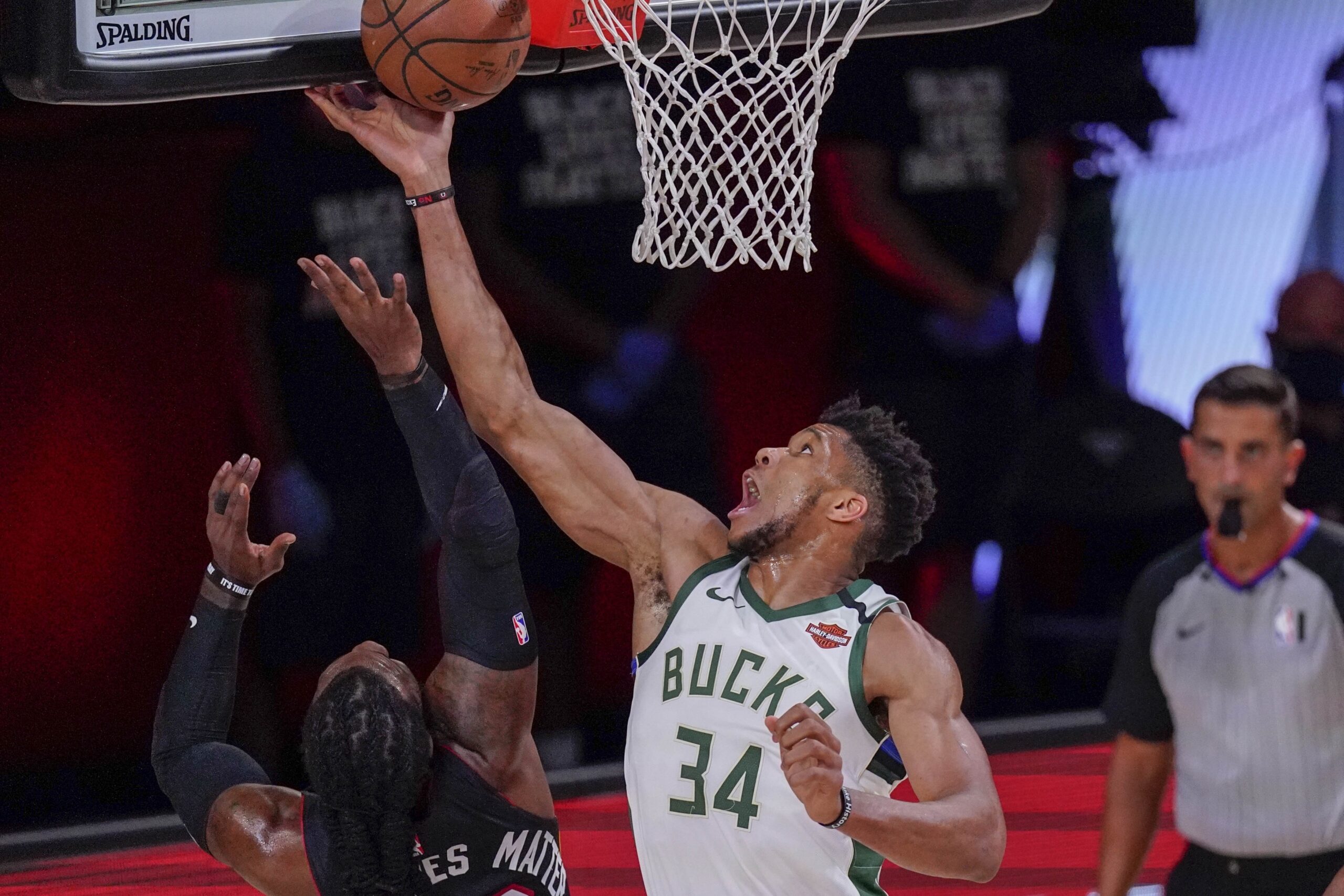 Milwaukee Bucks' Giannis Antetokounmpo tries to shoot past Miami Heat's Jae Crowder